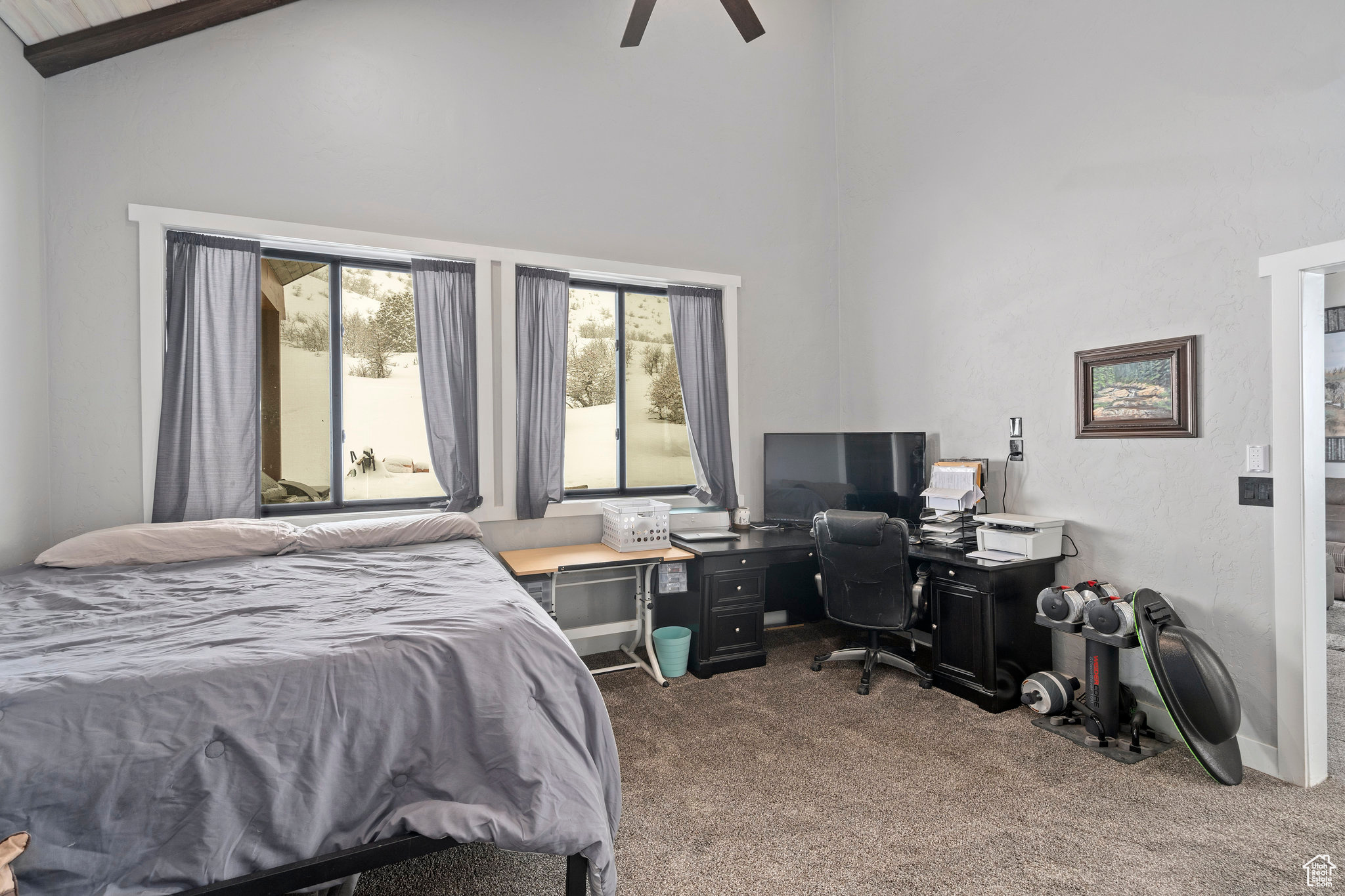 Bedroom featuring high vaulted ceiling, ceiling fan, and carpet floors