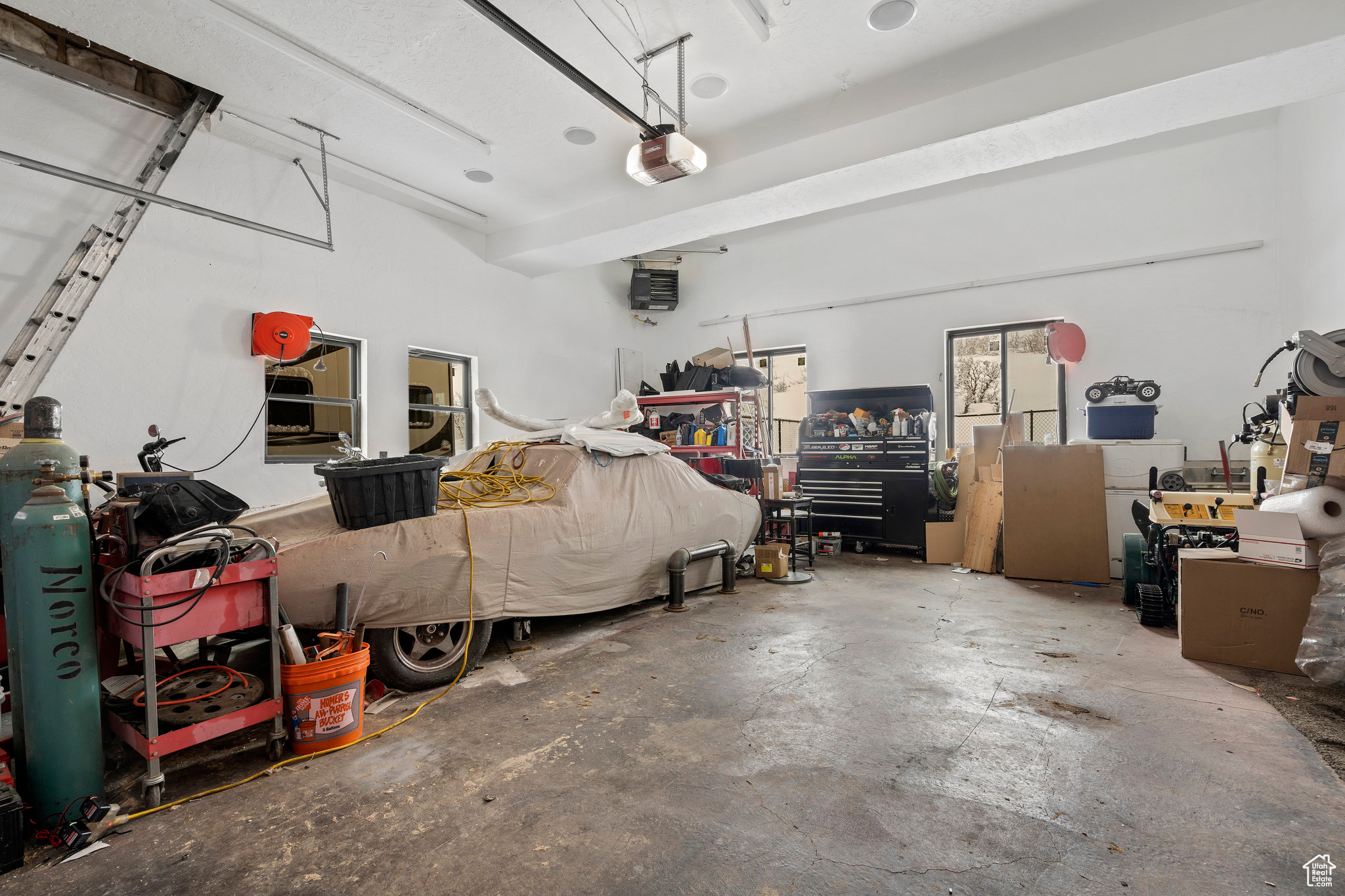 Garage featuring a garage door opener