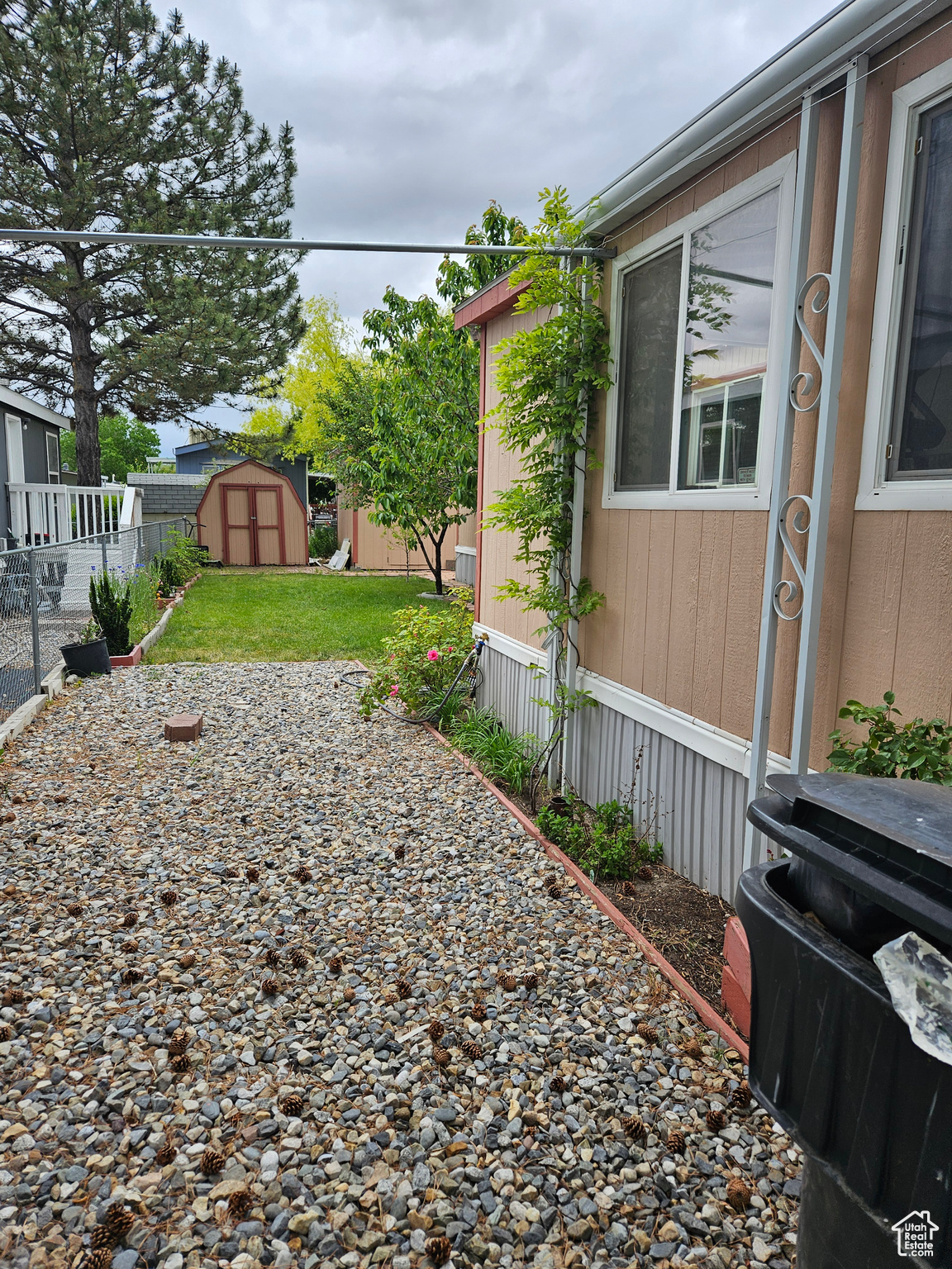 View of yard featuring a storage unit