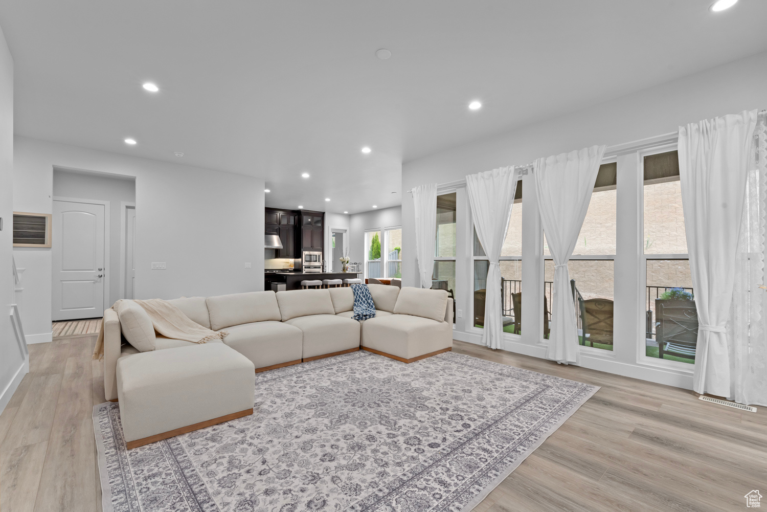 Living room with light hardwood / wood-style floors