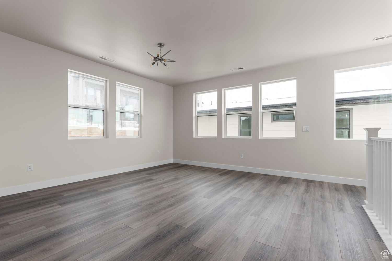 Unfurnished room with hardwood / wood-style flooring