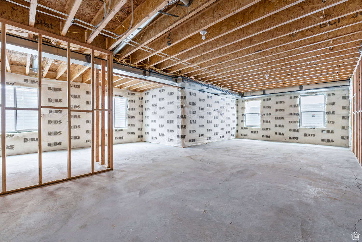 Basement featuring a healthy amount of sunlight