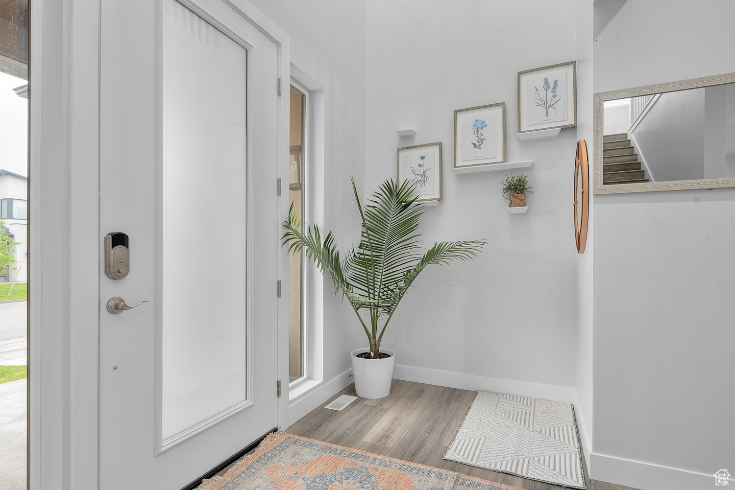 Entryway featuring a healthy amount of sunlight and light wood-type flooring