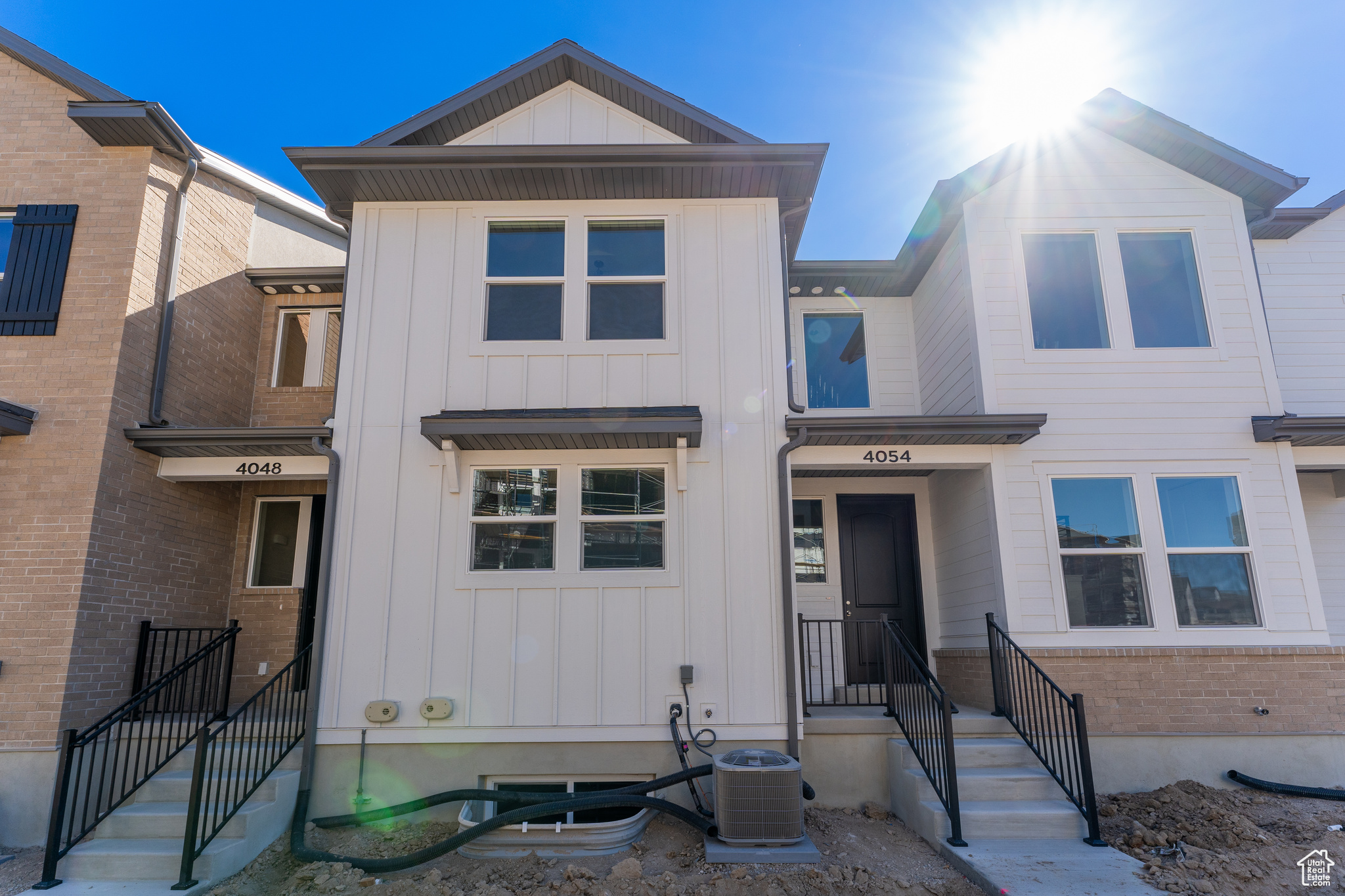 View of front of house with central AC