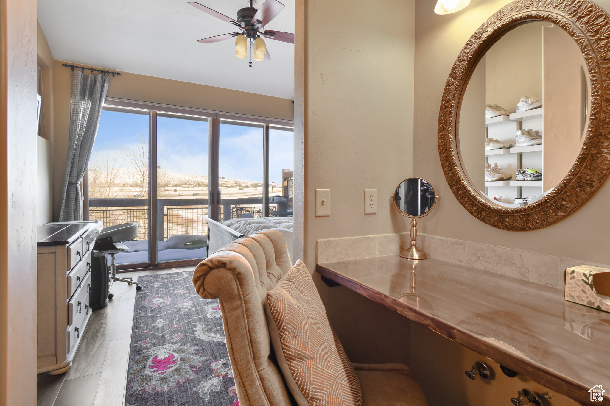 Bathroom featuring vanity, ceiling fan, and tile floors