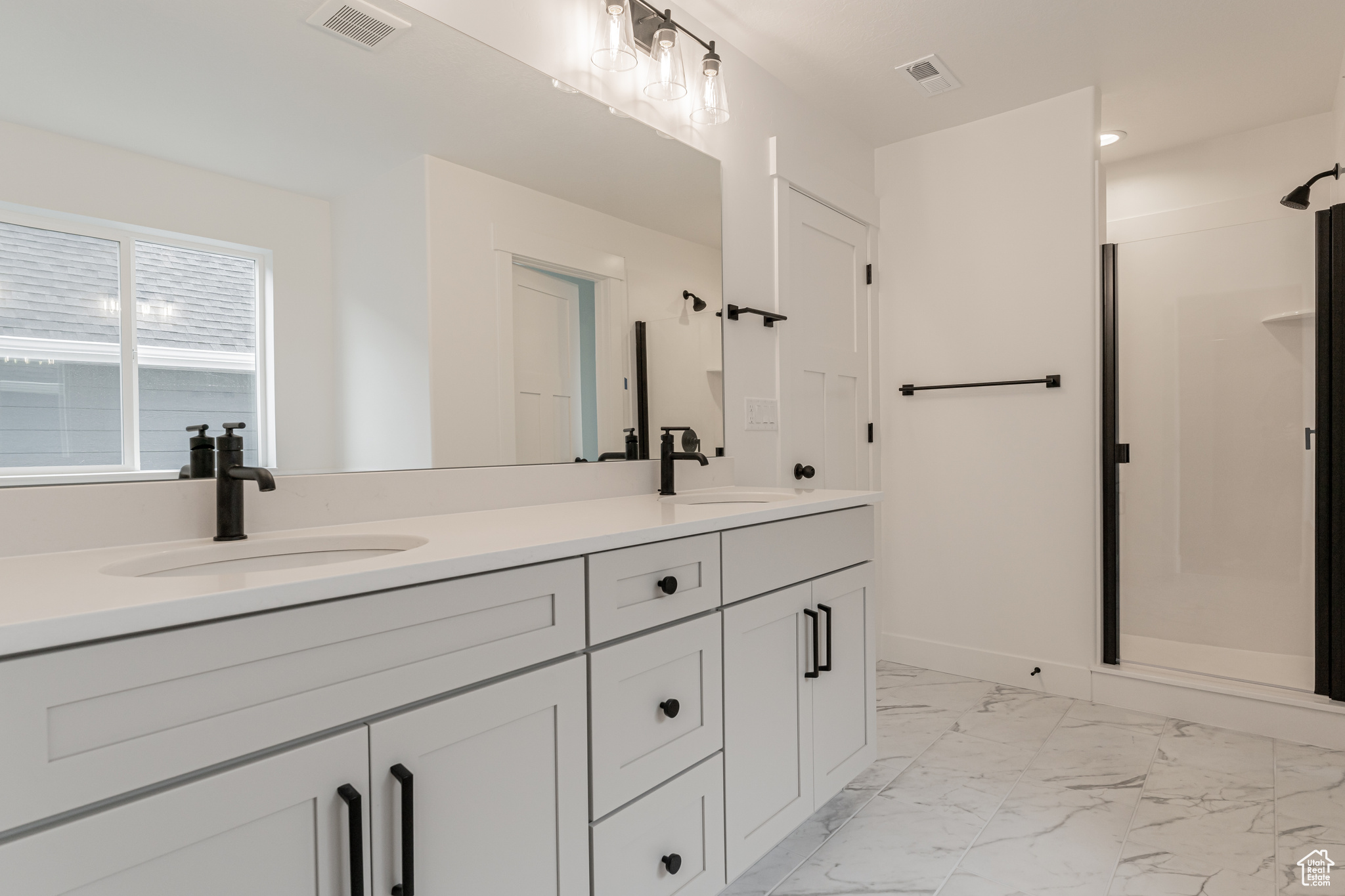 Bathroom with walk in shower and vanity