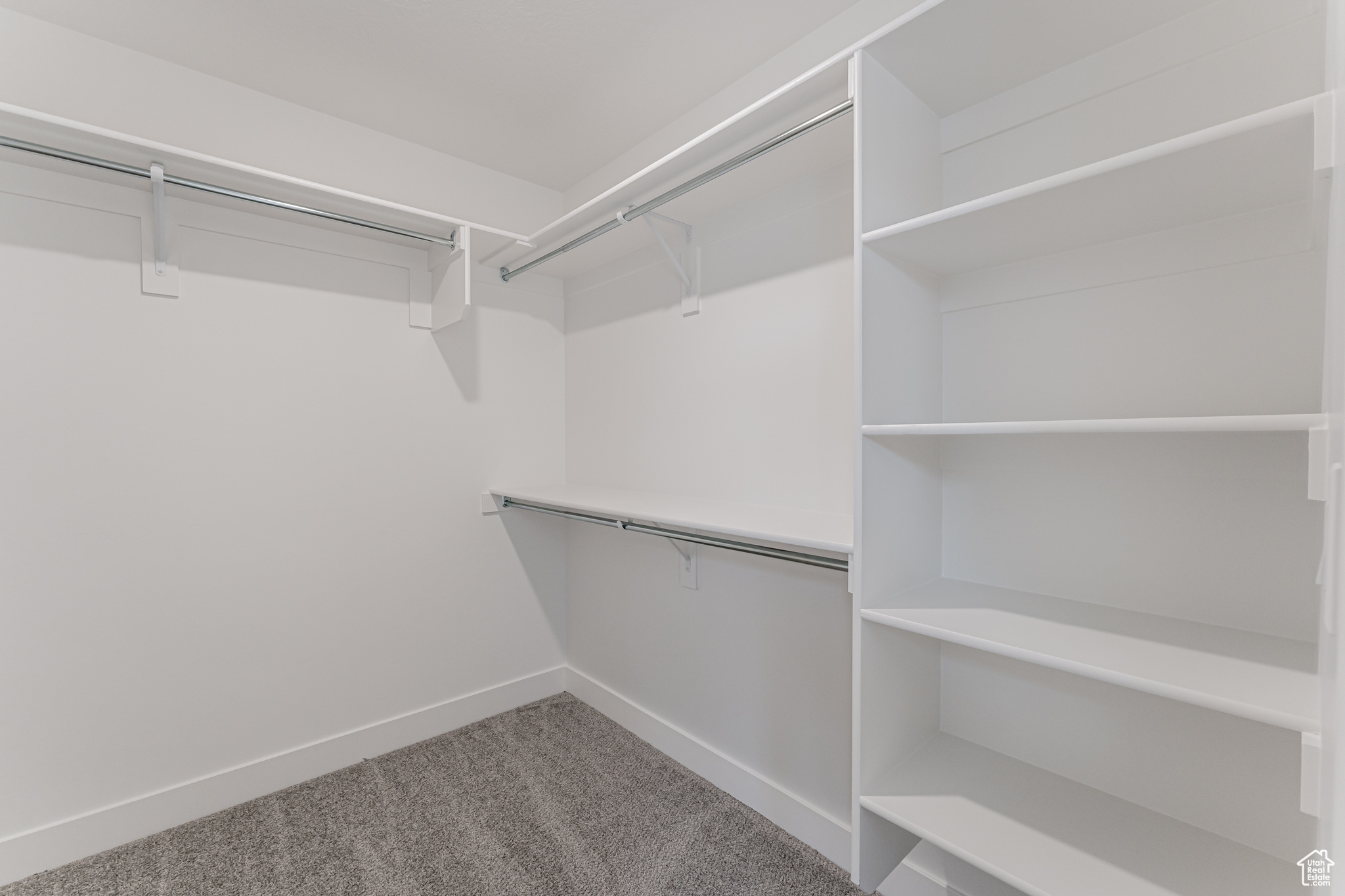 Spacious closet with carpet flooring