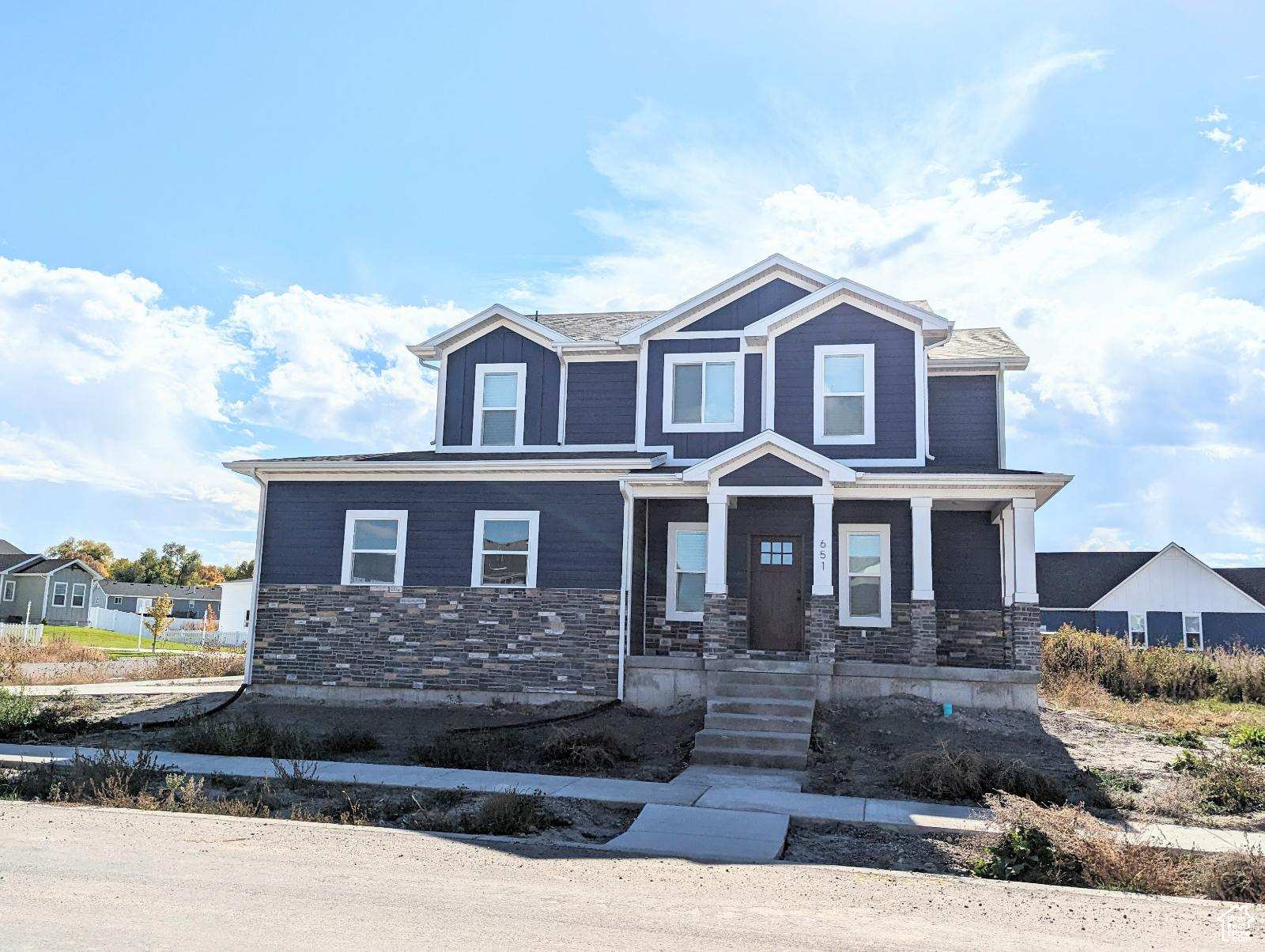 View of front of home with covered porch