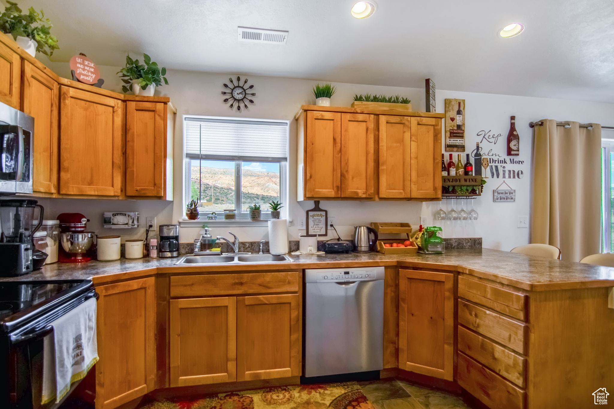 Kitchen with stainless steel appliances and sink