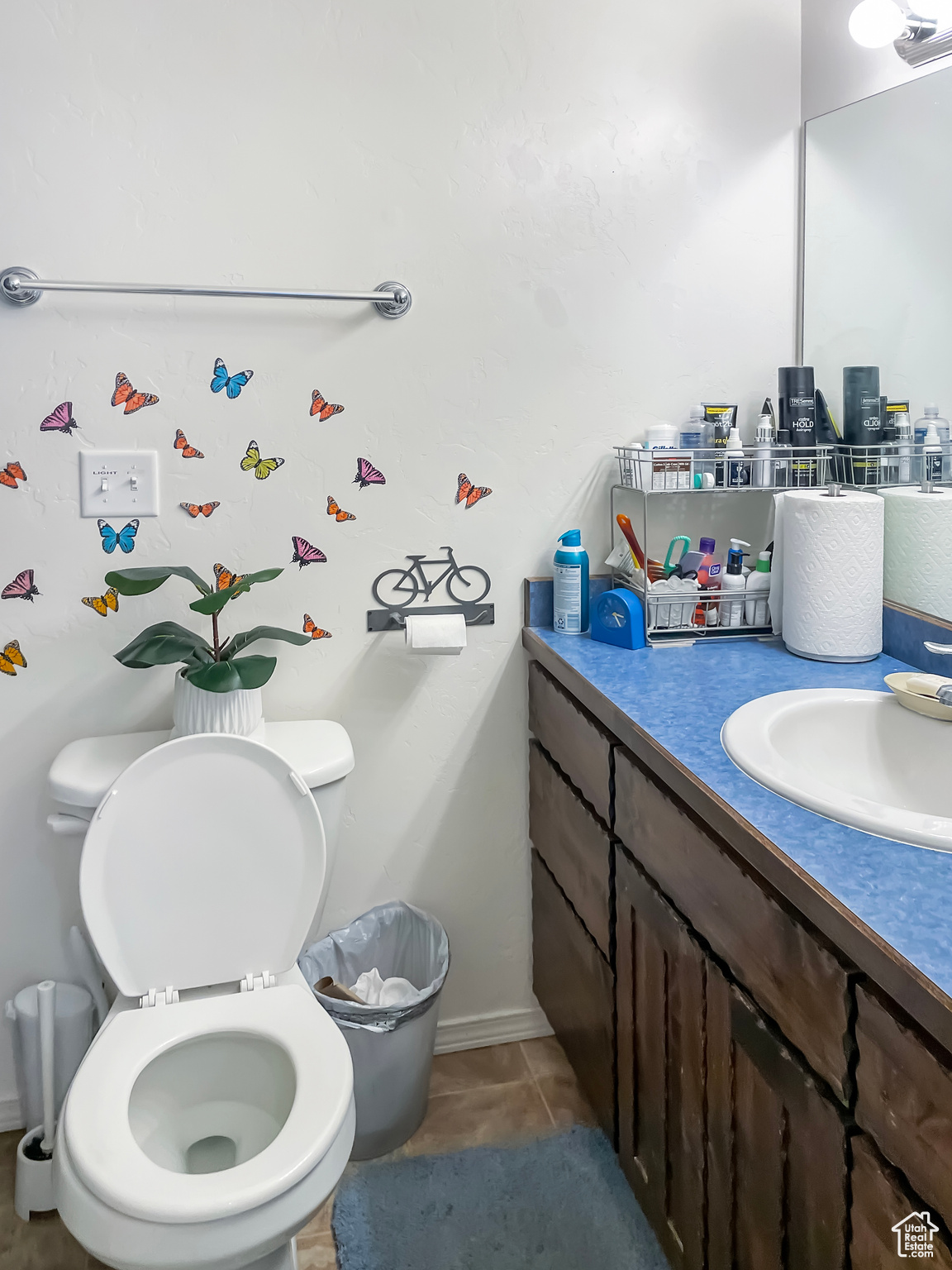 Bathroom with tile floors, toilet, and oversized vanity