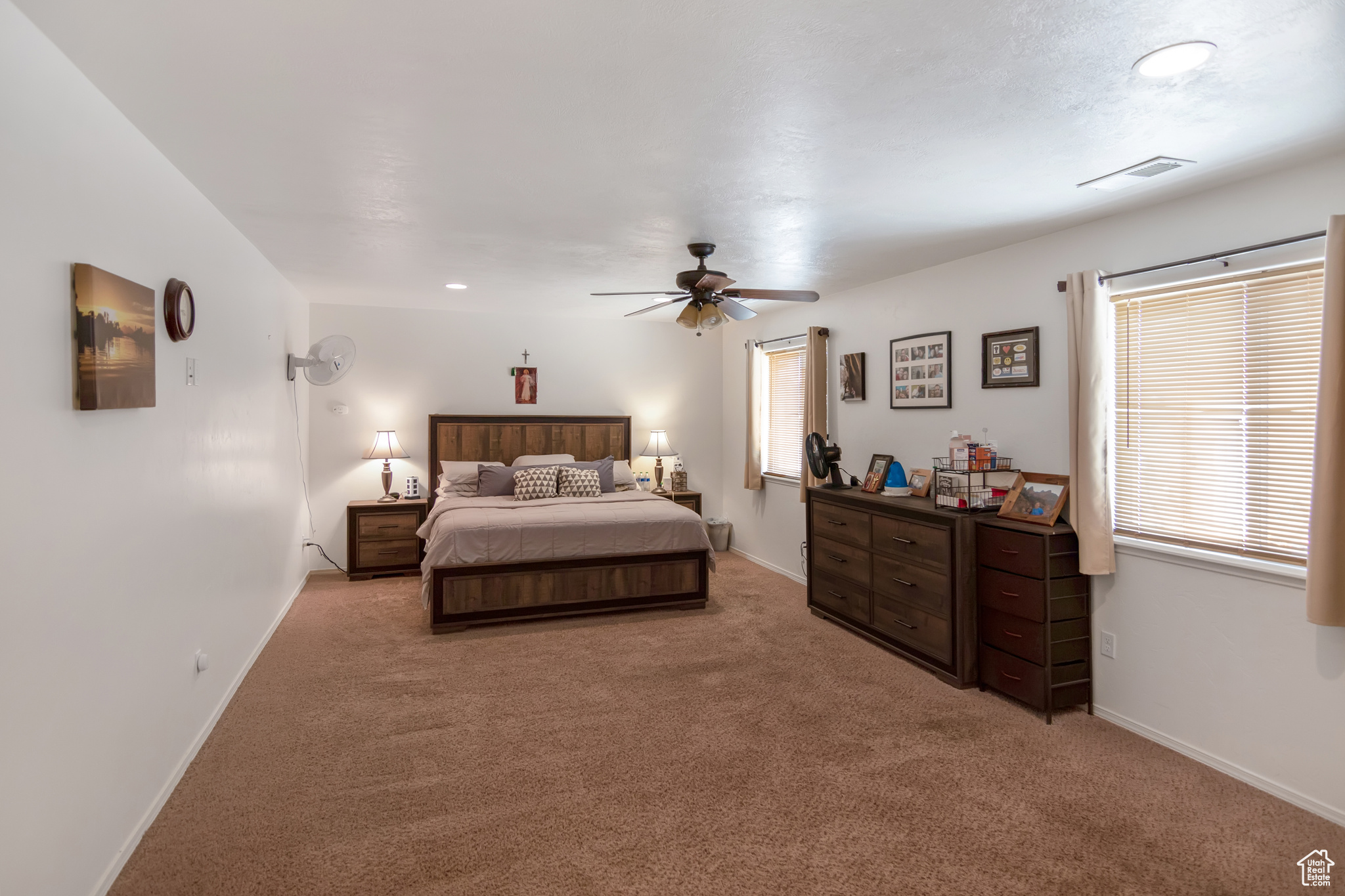 Bedroom featuring carpet and ceiling fan