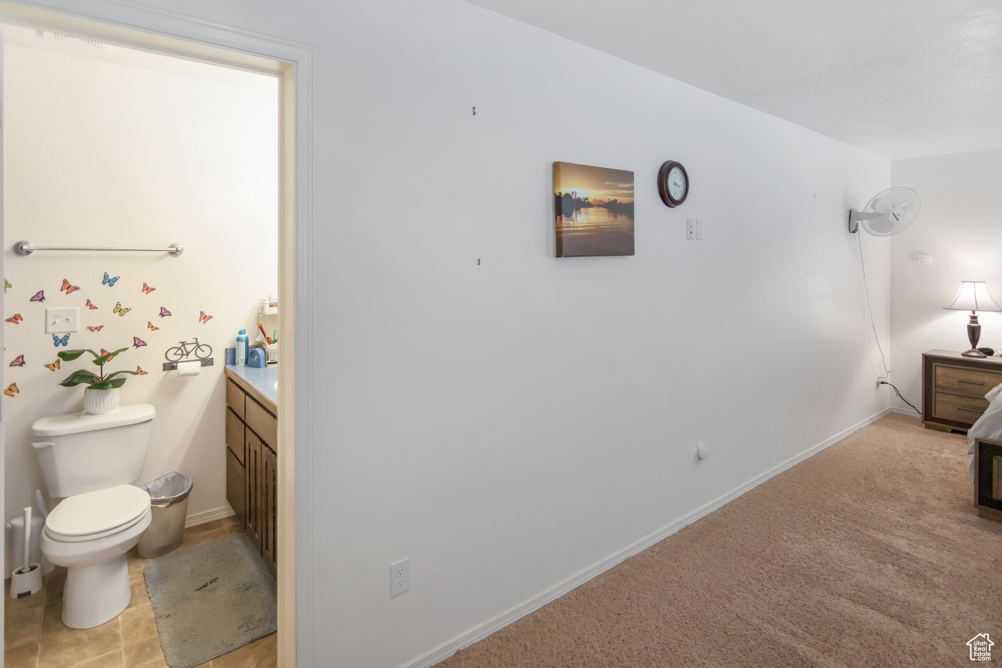 Interior space with tile floors, toilet, and vanity