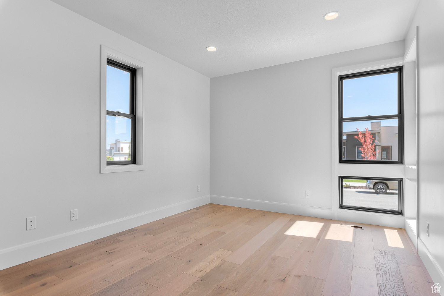 Unfurnished room featuring light hardwood / wood-style floors