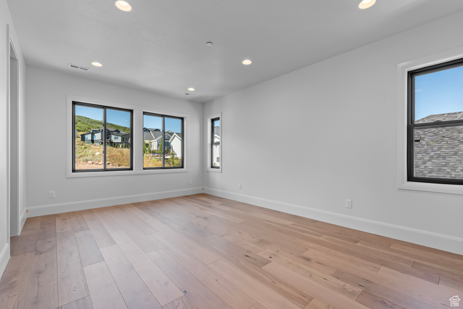 Empty room featuring light wood-type flooring