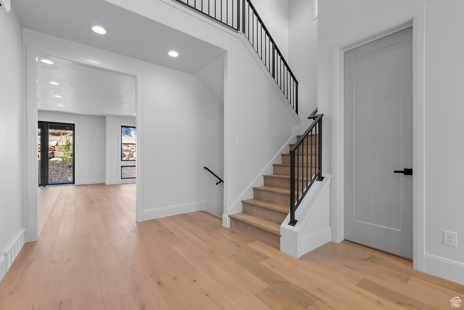 Staircase with hardwood / wood-style floors