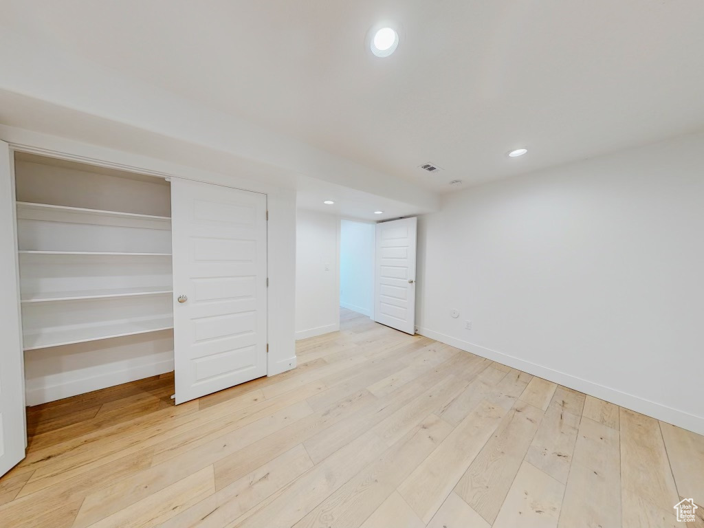 Unfurnished bedroom with light hardwood / wood-style floors