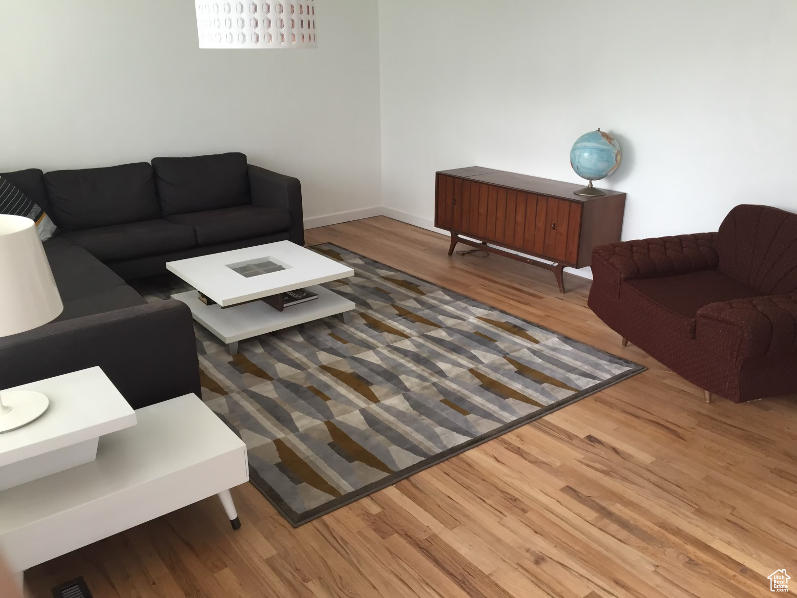 Living room with hardwood / wood-style flooring