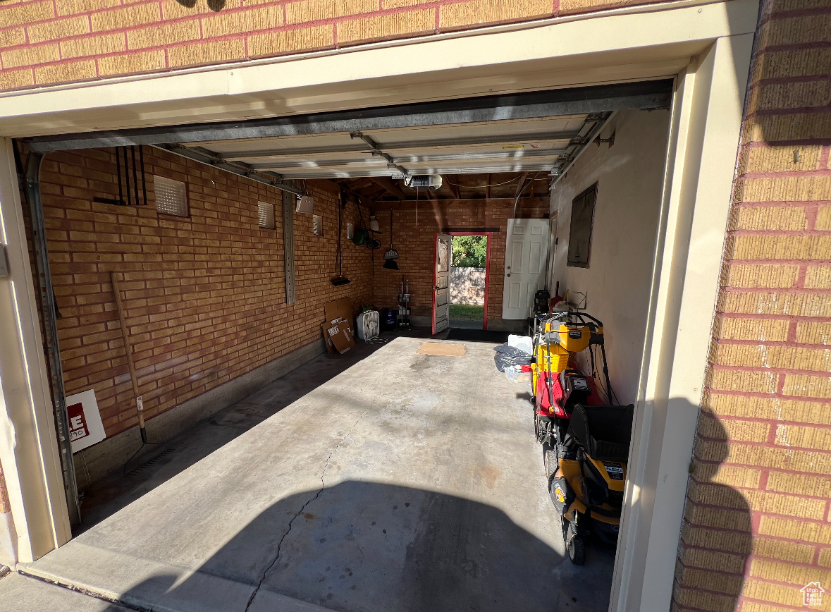 Garage featuring a garage door opener