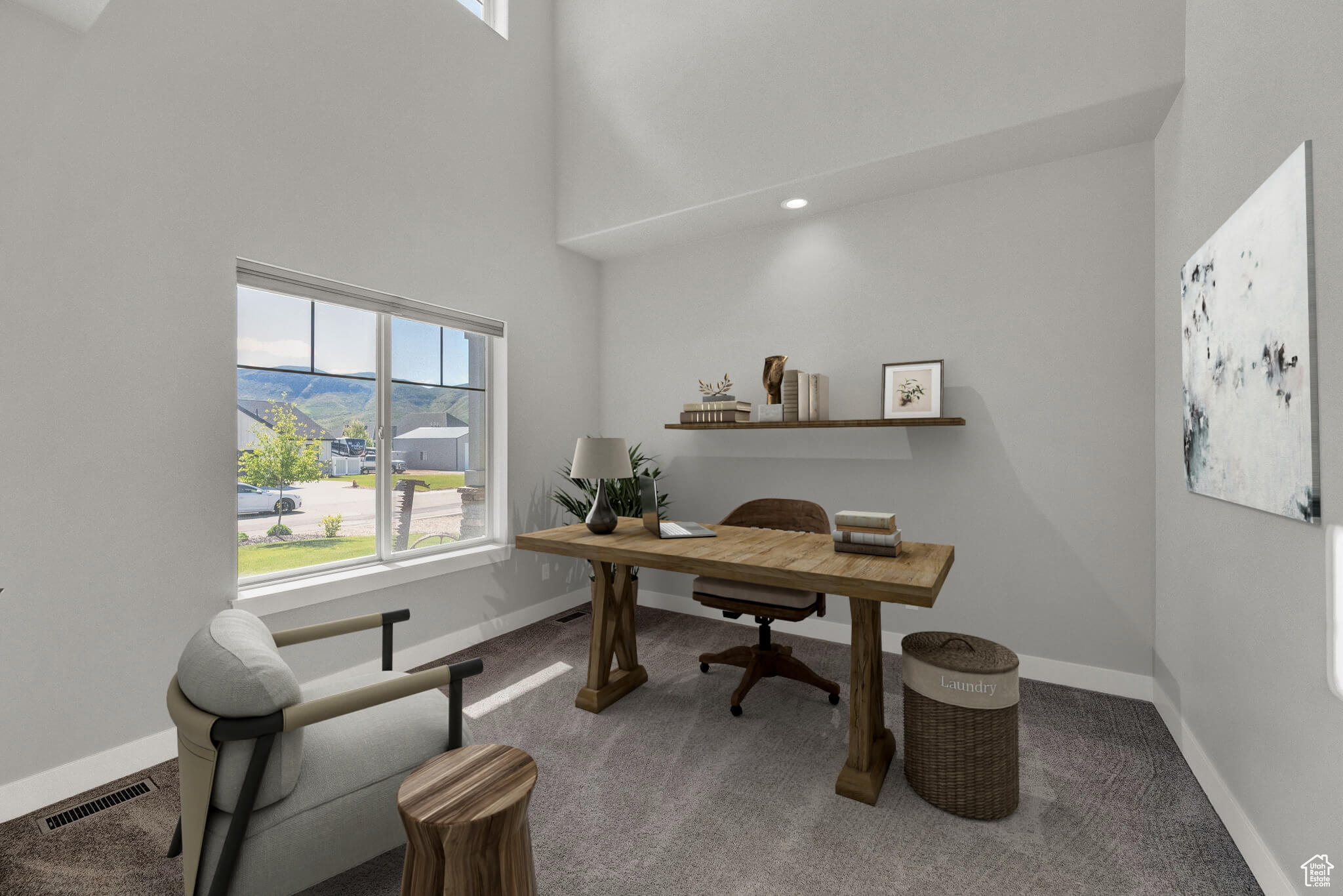 Office featuring a towering ceiling and carpet floors