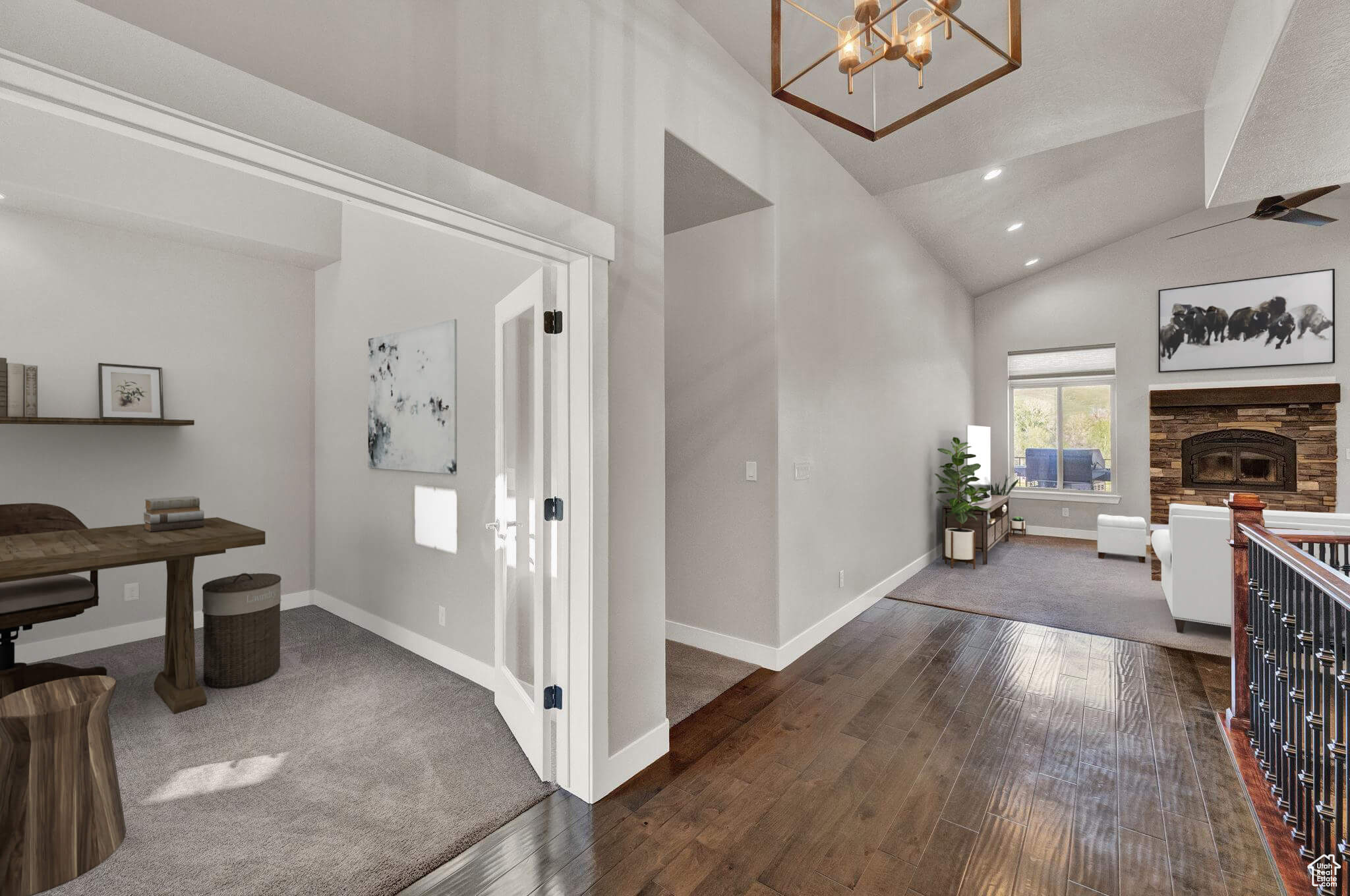 Corridor with a chandelier, vaulted ceiling, and dark hardwood / wood-style flooring