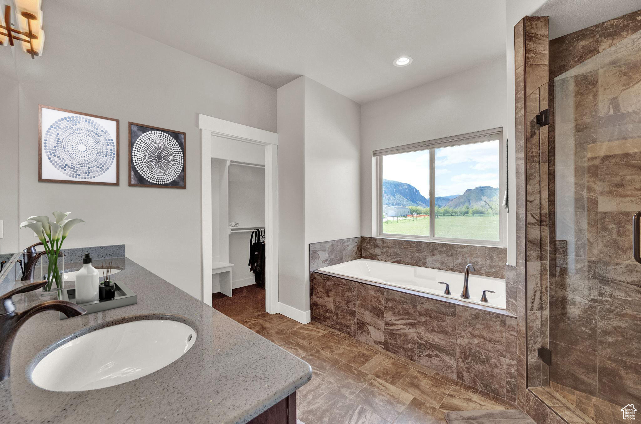 Bathroom featuring vanity, tile flooring, shower with separate bathtub, and a mountain view