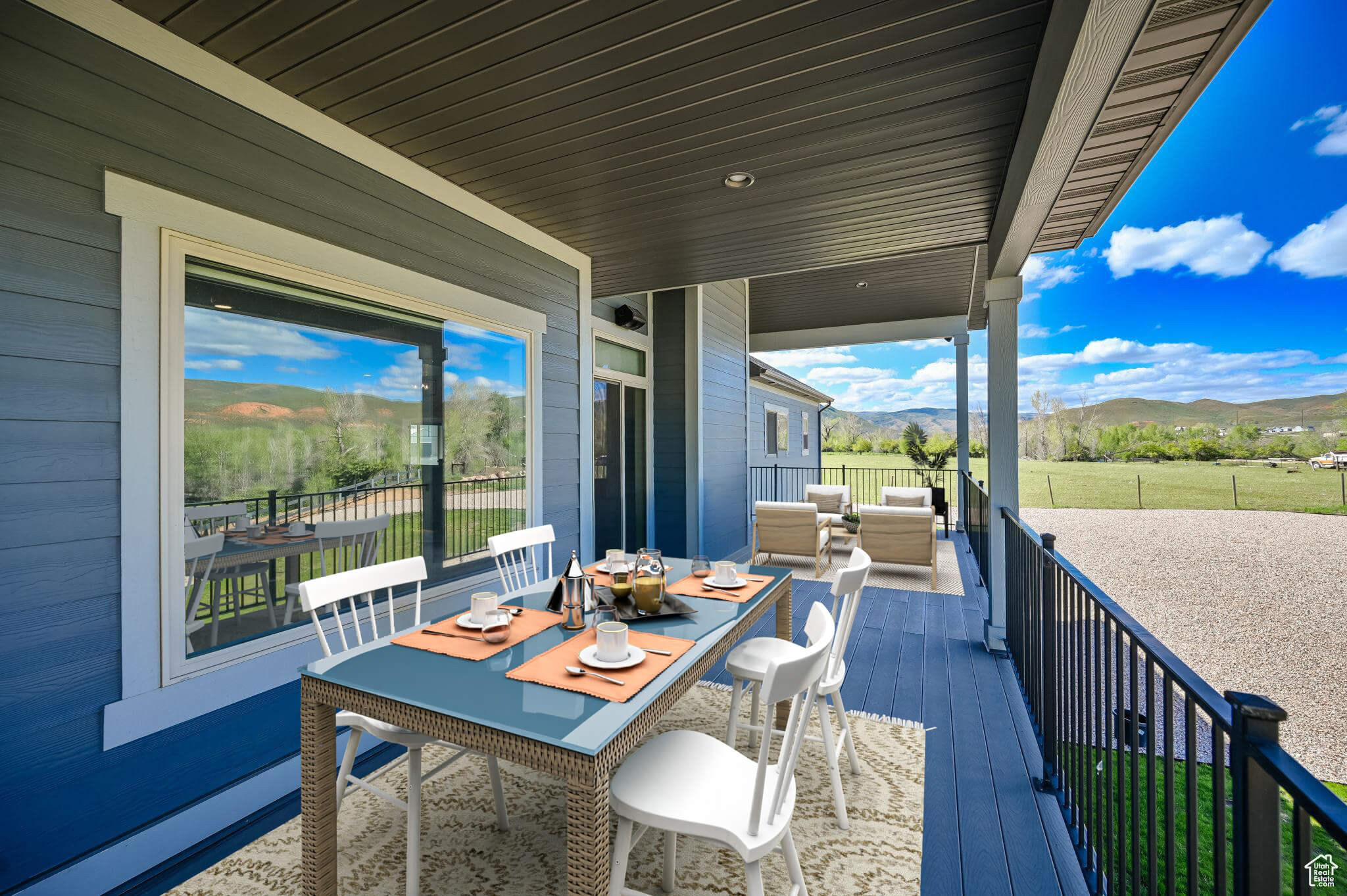 Wooden deck featuring a mountain view and an outdoor hangout area