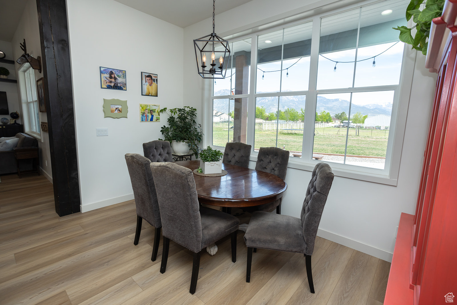 Dining room with a notable chandelier and light hardwood / wood-style flooring