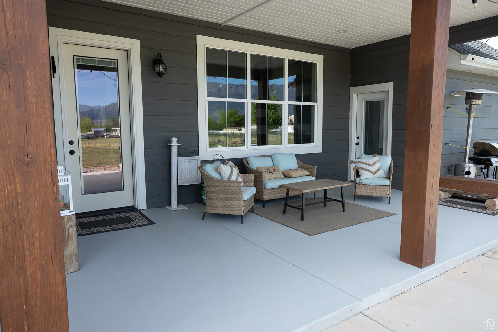 View of patio with outdoor lounge area and a mountain view