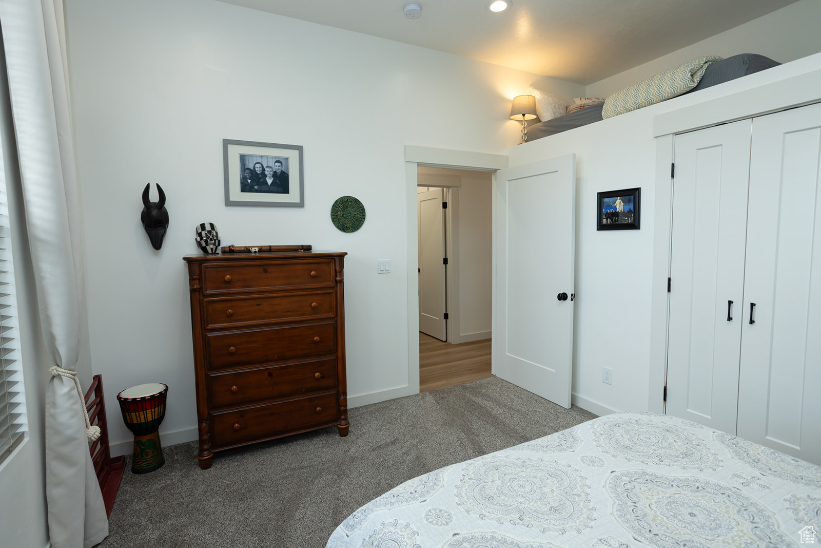 Bedroom featuring a closet and dark carpet