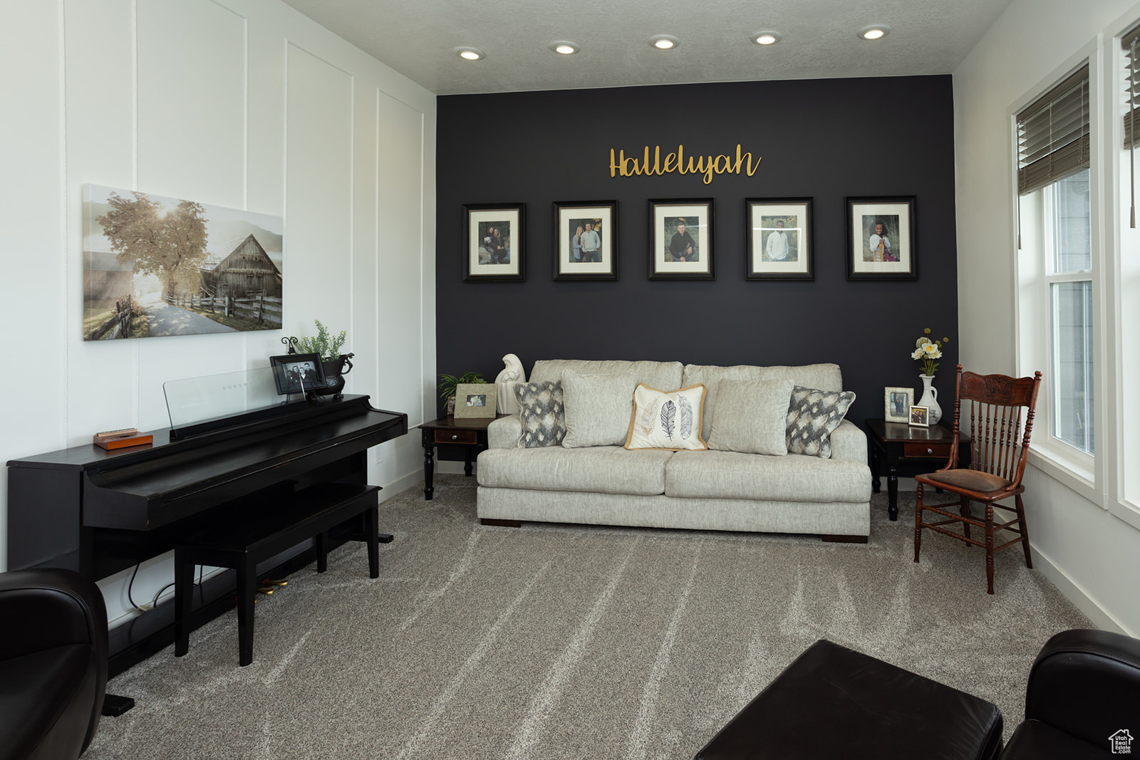 Carpeted living room featuring plenty of natural light