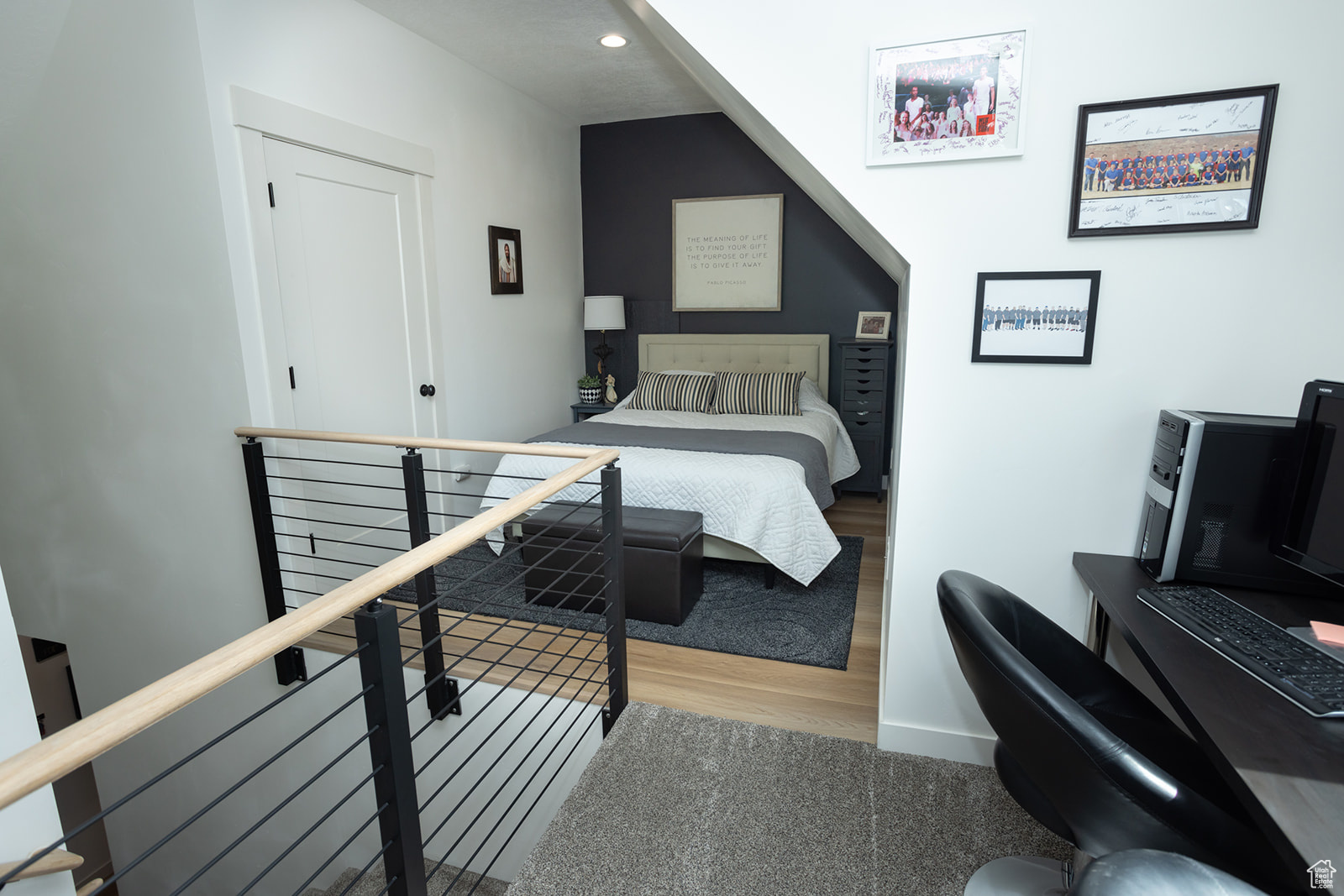 Bedroom with hardwood / wood-style flooring