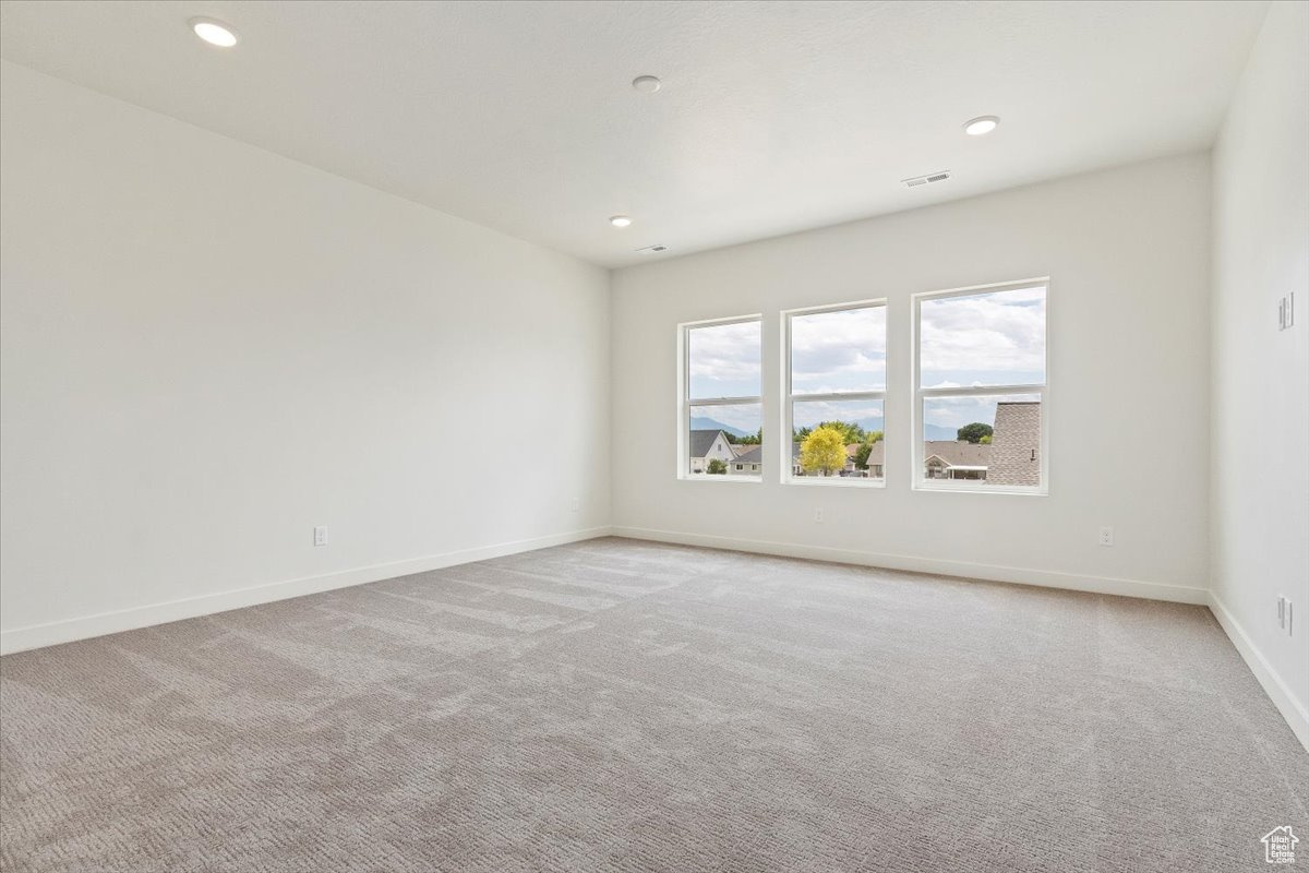 View of carpeted spare room