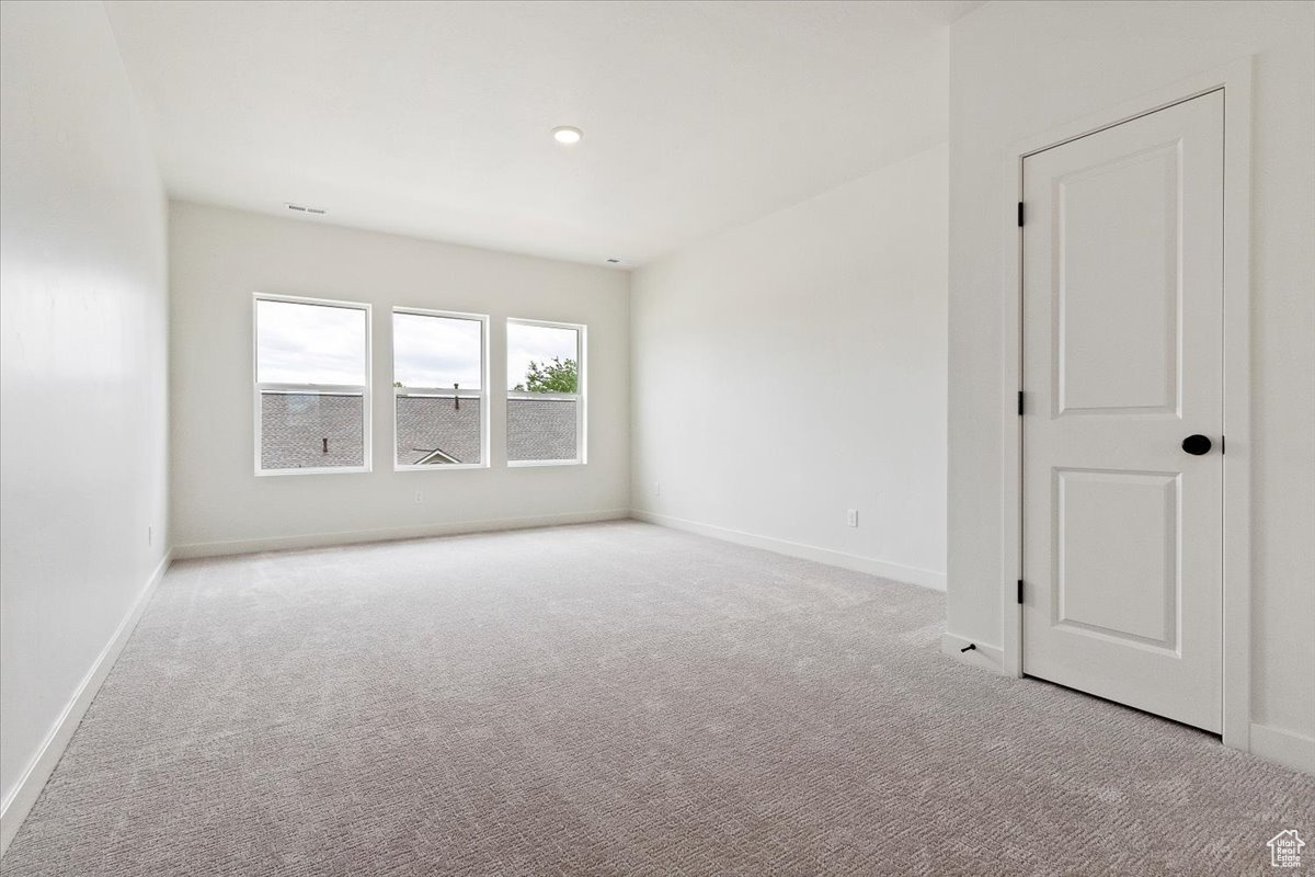 View of carpeted spare room