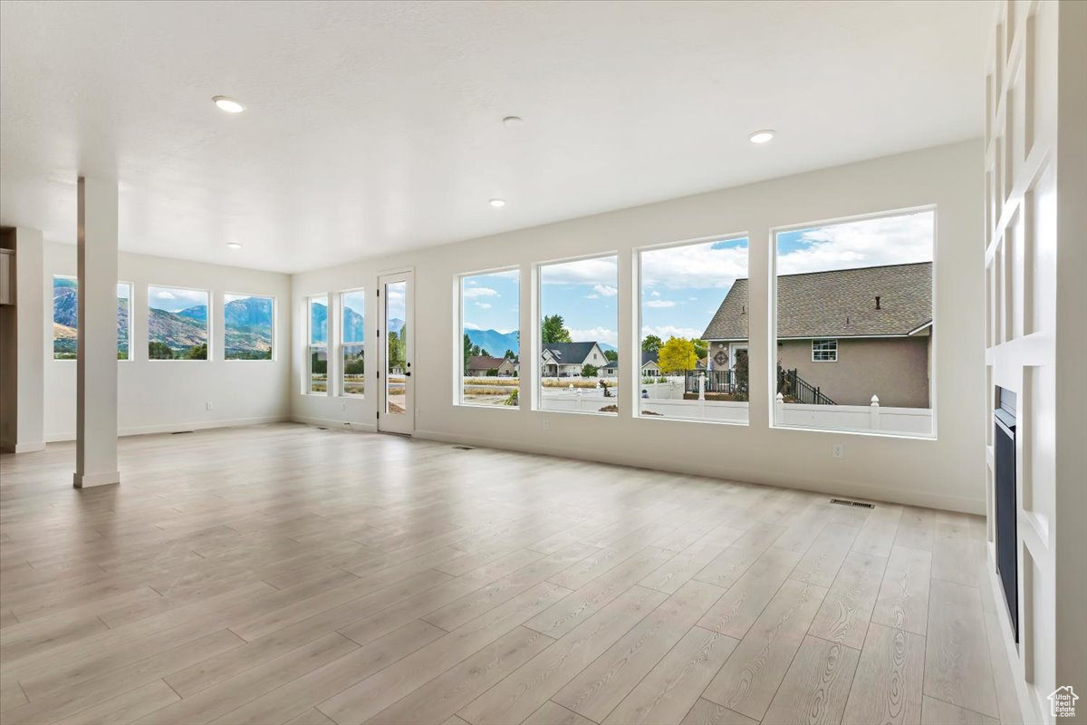 Unfurnished room featuring light wood-type flooring