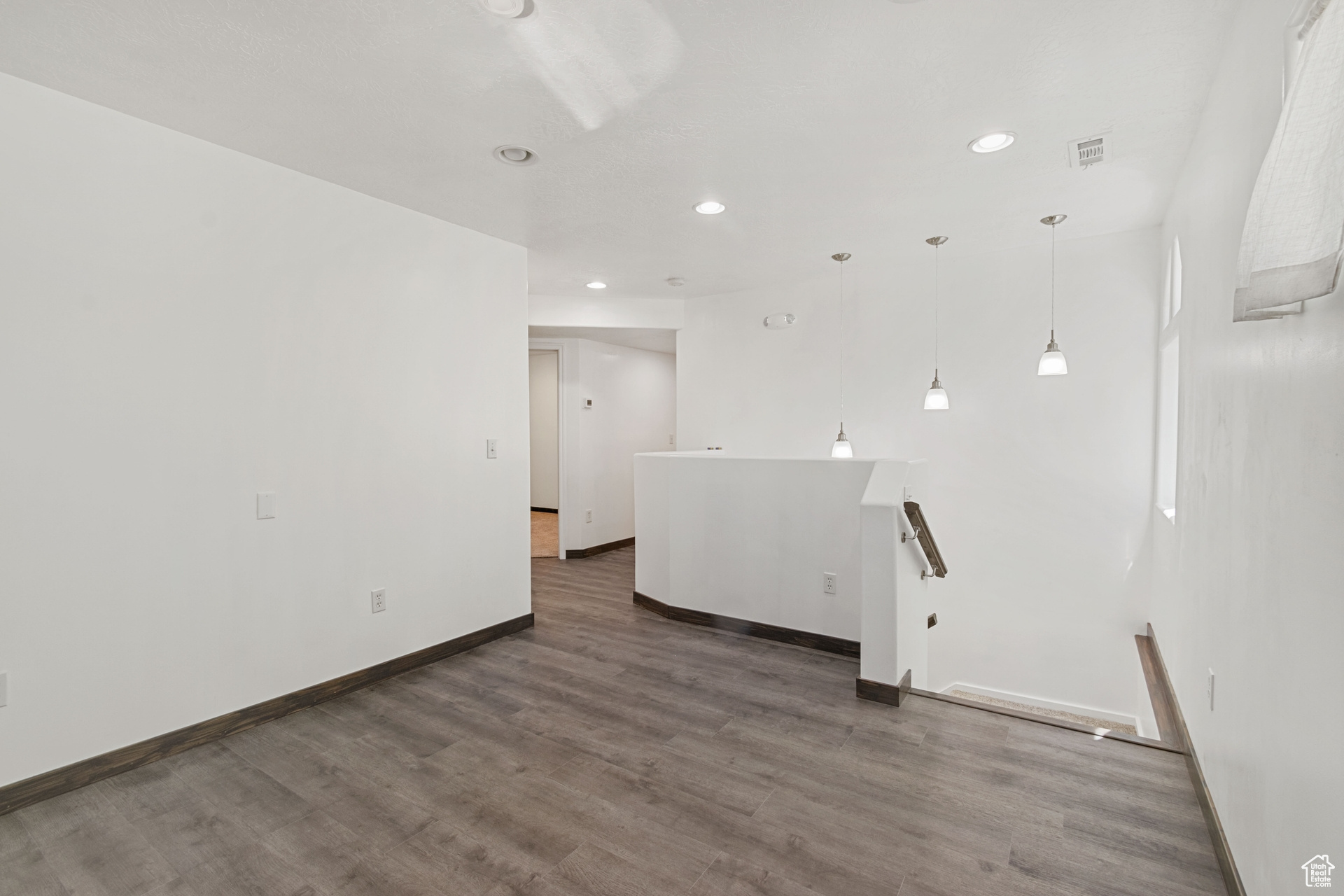 Unfurnished room featuring hardwood / wood-style floors