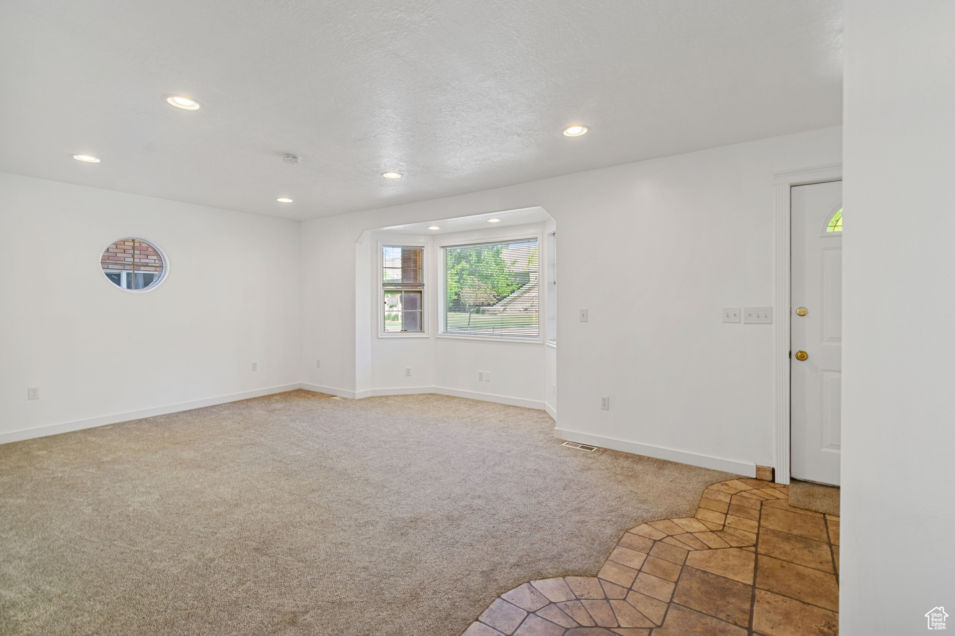 Empty room with carpet floors