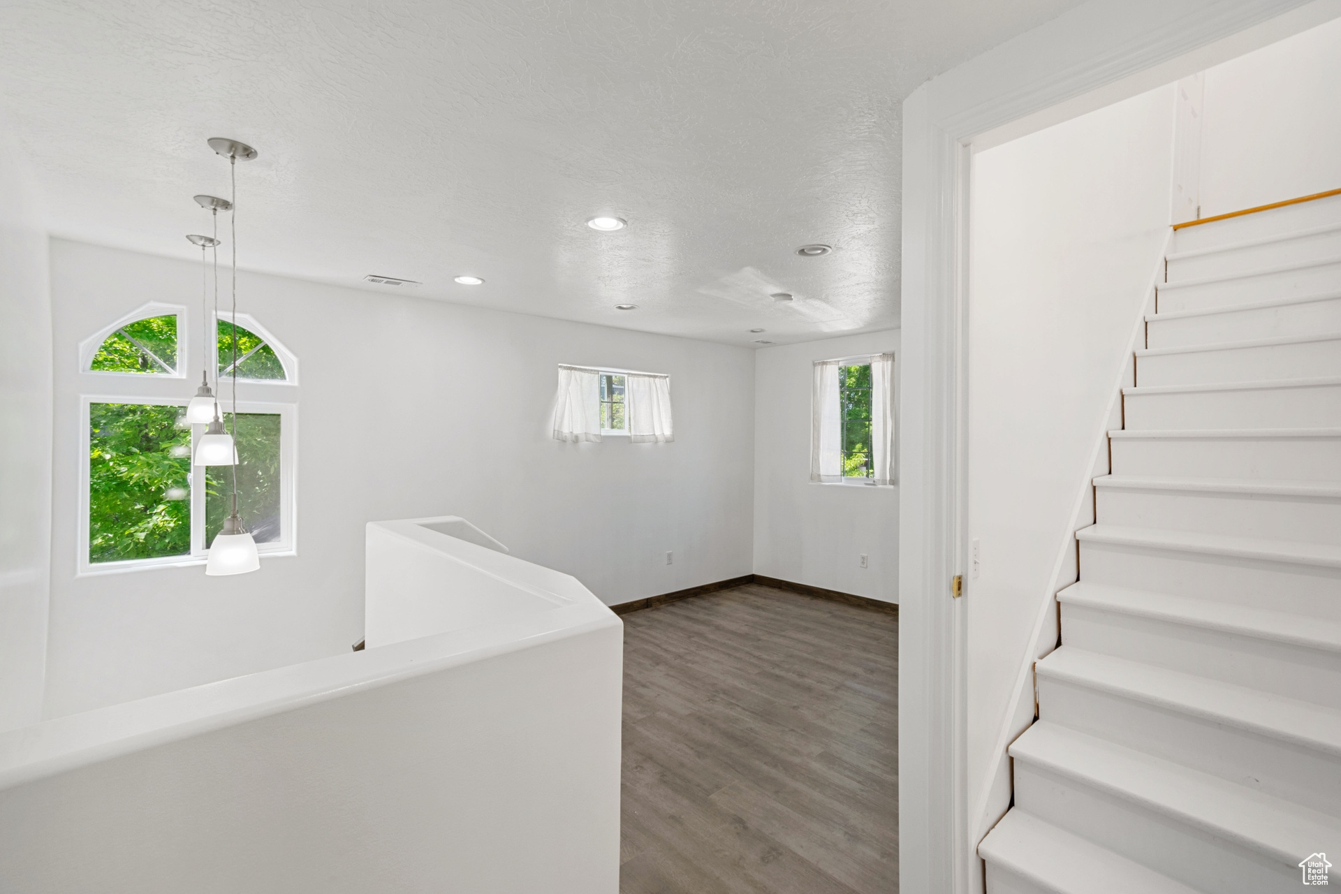 Interior space featuring plenty of natural light and hardwood / wood-style flooring