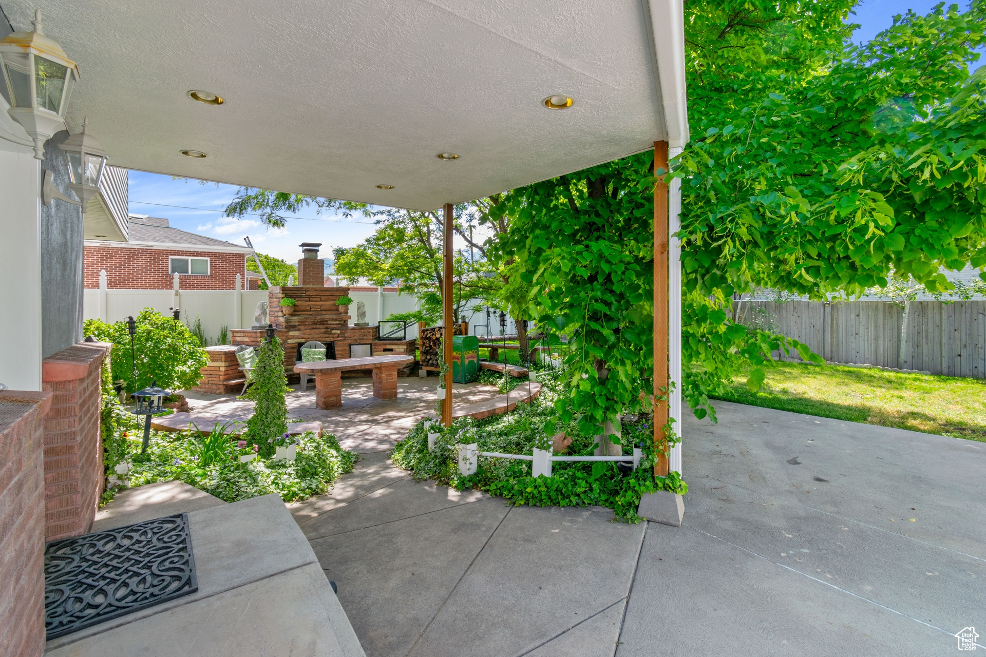 View of patio featuring an outdoor fireplace