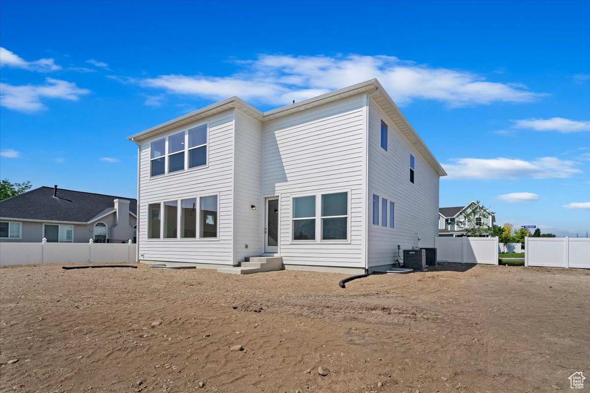 Back of house with cooling unit