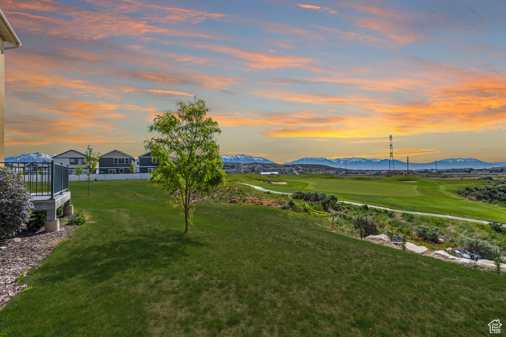 Yard at dusk featuring a mountain view