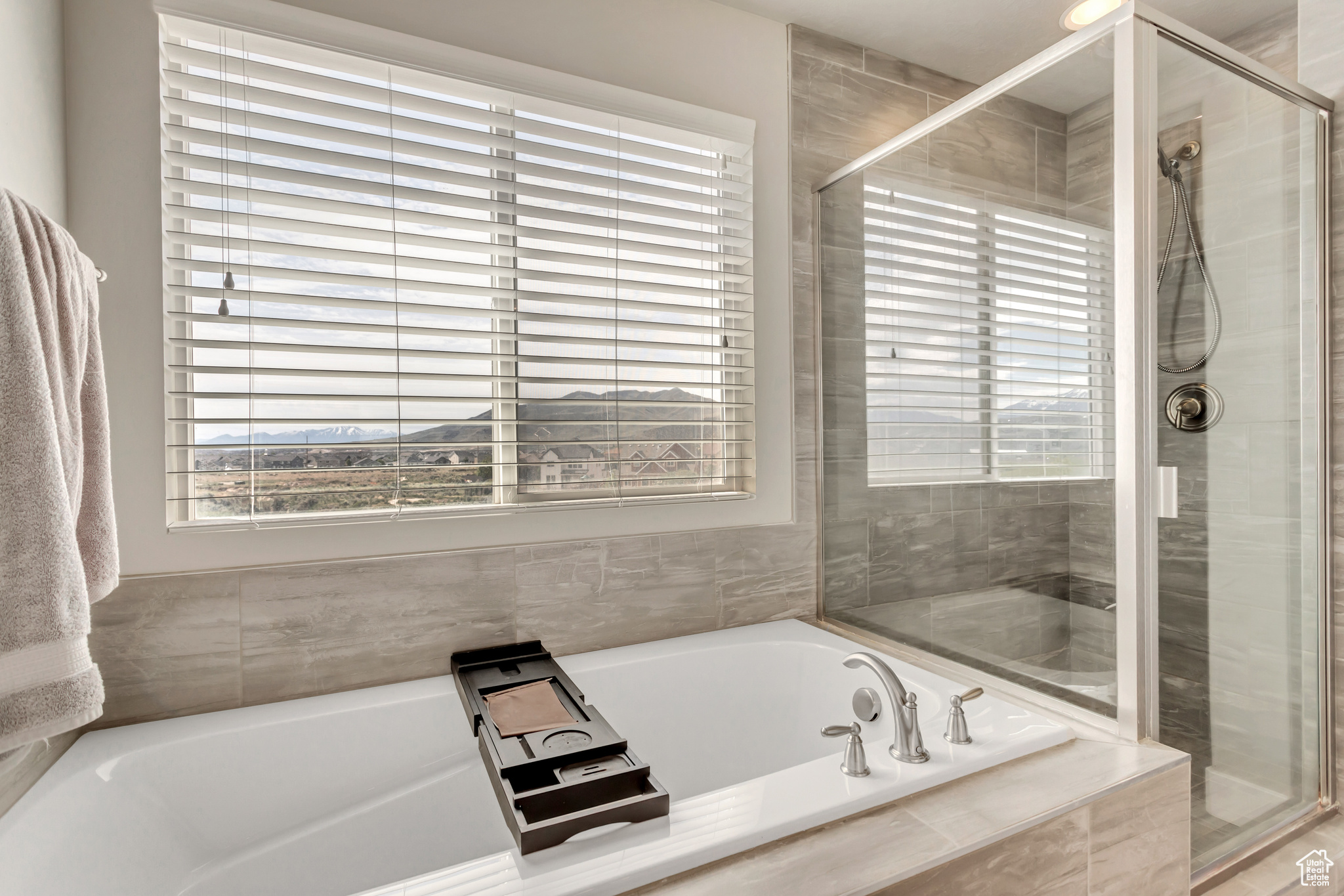 Bathroom featuring shower with separate bathtub