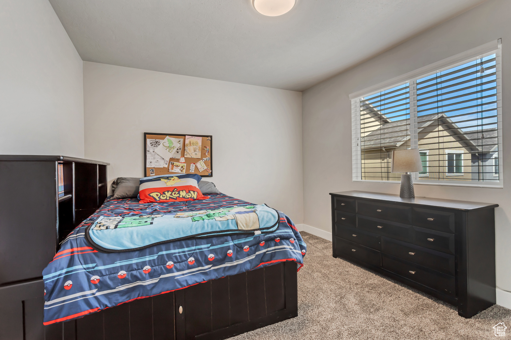 Bedroom with light colored carpet