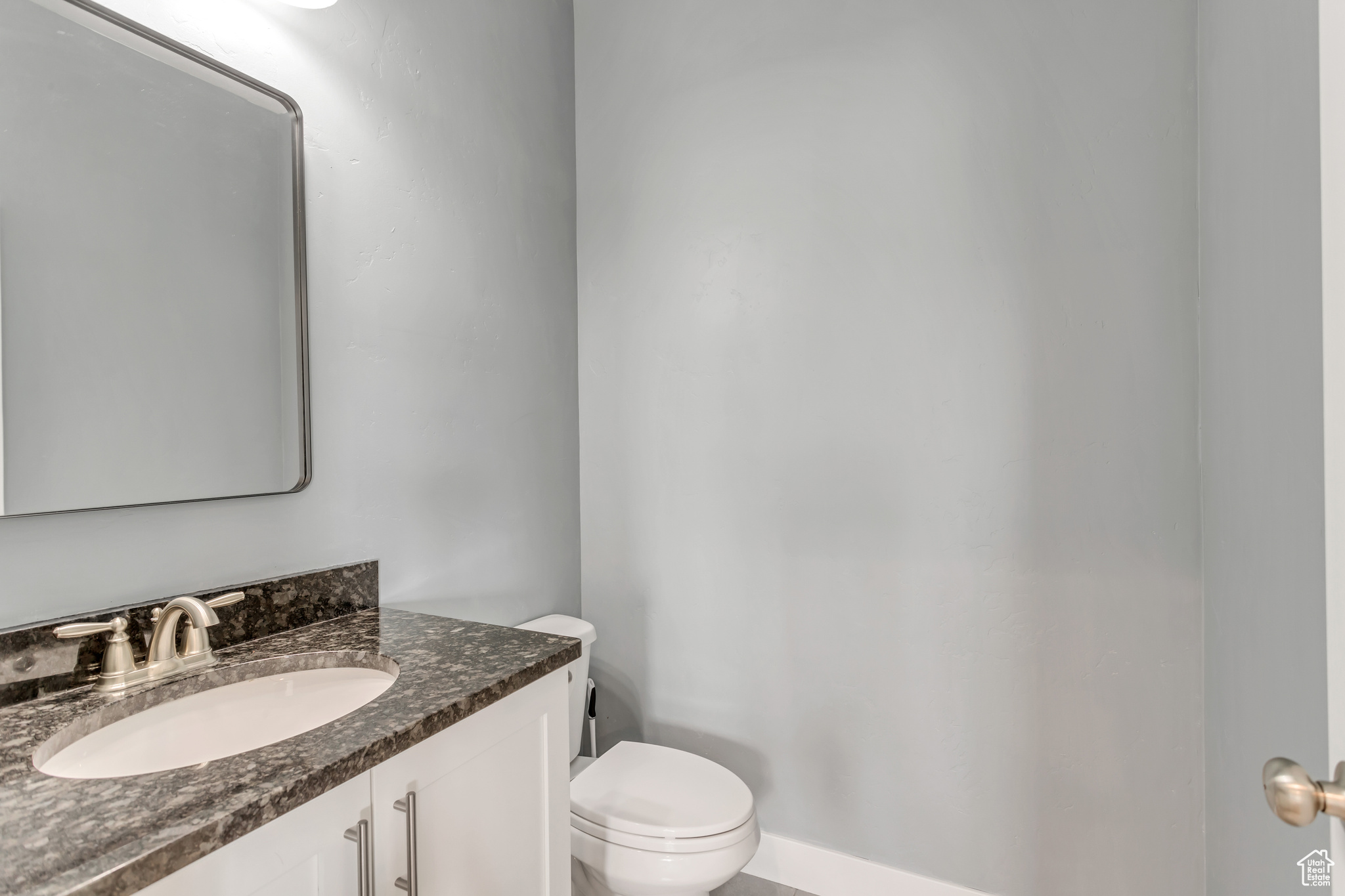 Bathroom with vanity and toilet