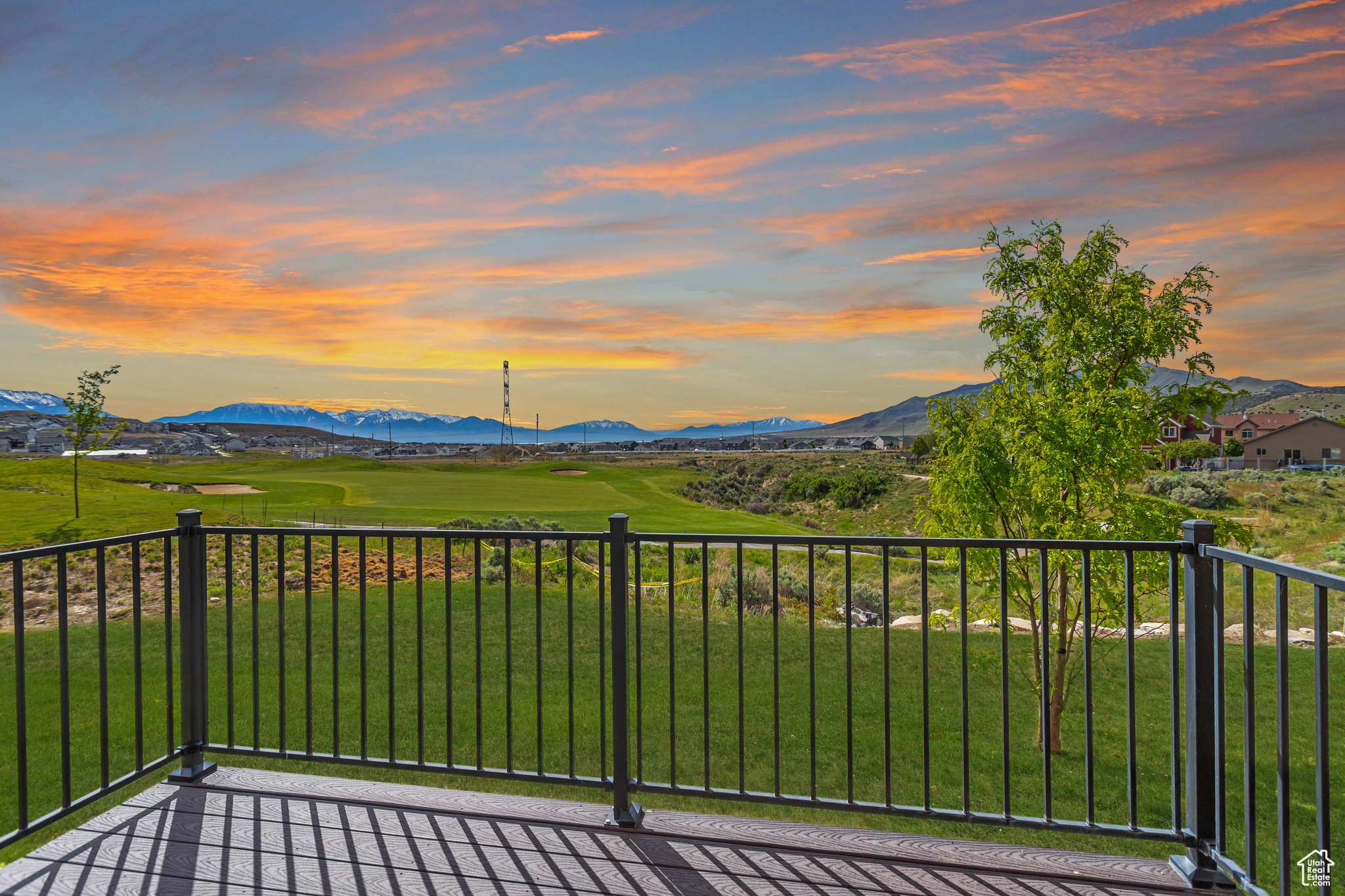 Balcony at dusk featuring a mountain view