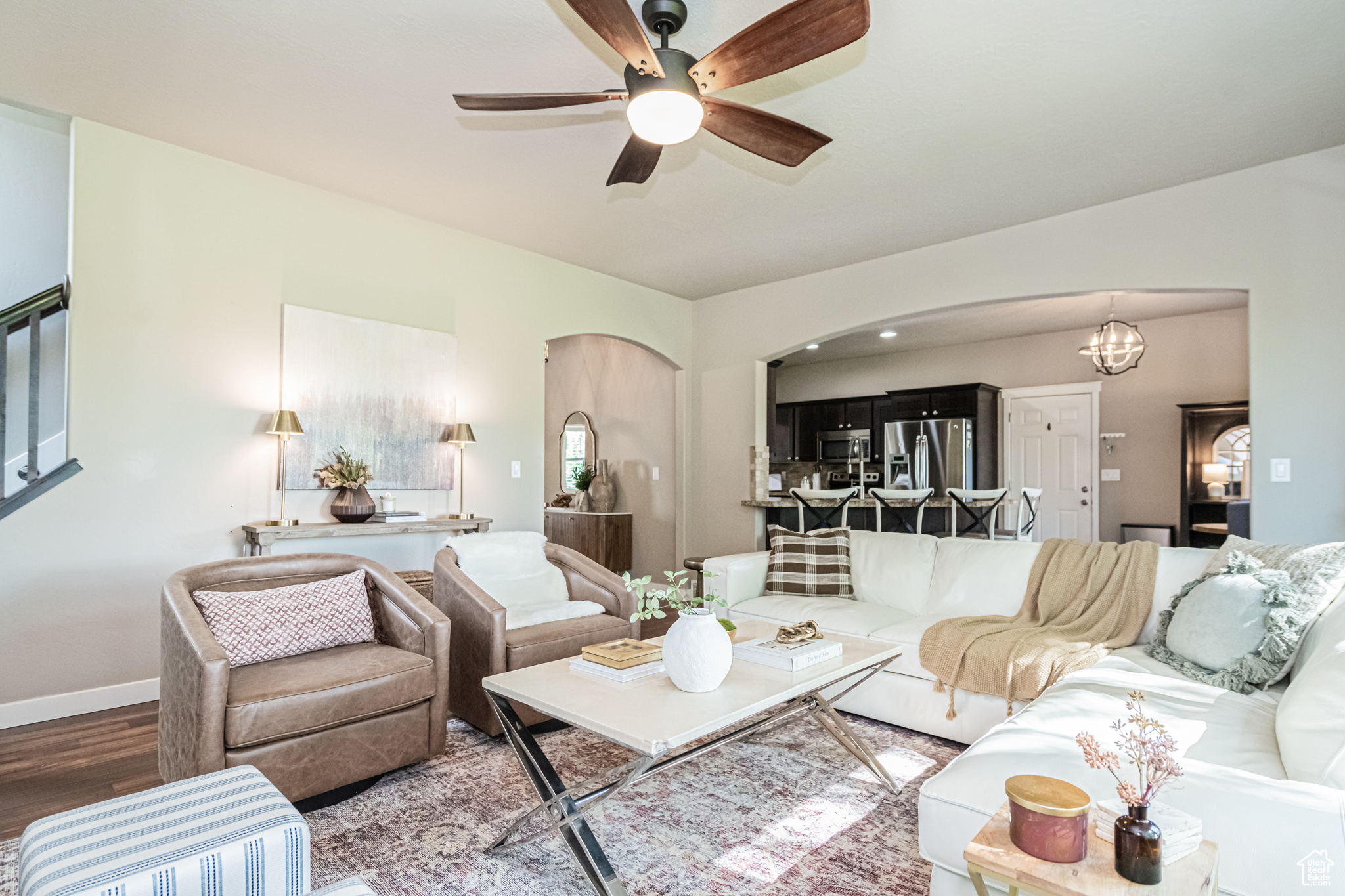 Living room featuring ceiling fan and wood-type flooring