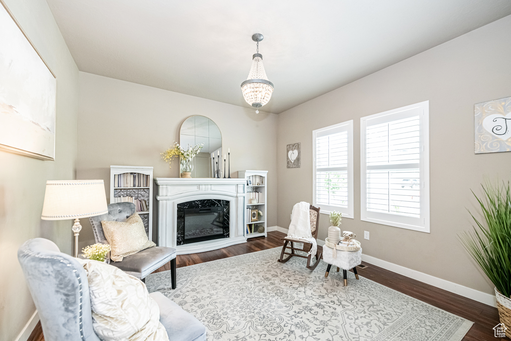 Formal living room with dark wood-type flooring