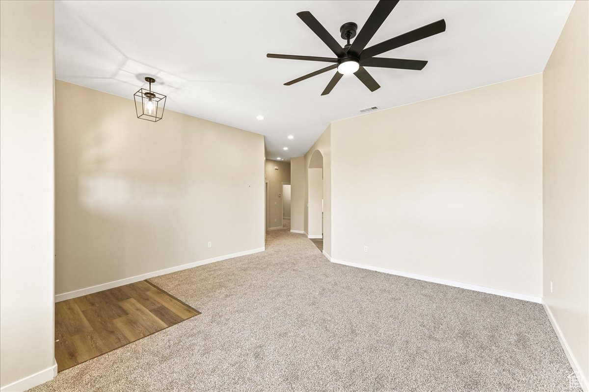 Spare room with ceiling fan and hardwood / wood-style floors