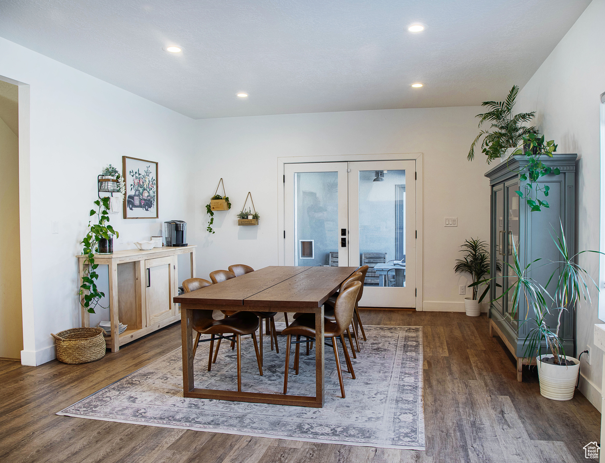 Dining area featuring dark hardwood / wood-style floors and french doors