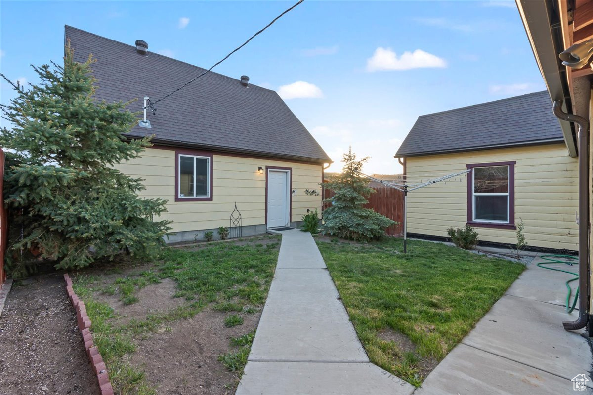 Backyard , path leading to garage side door. (looking north west)