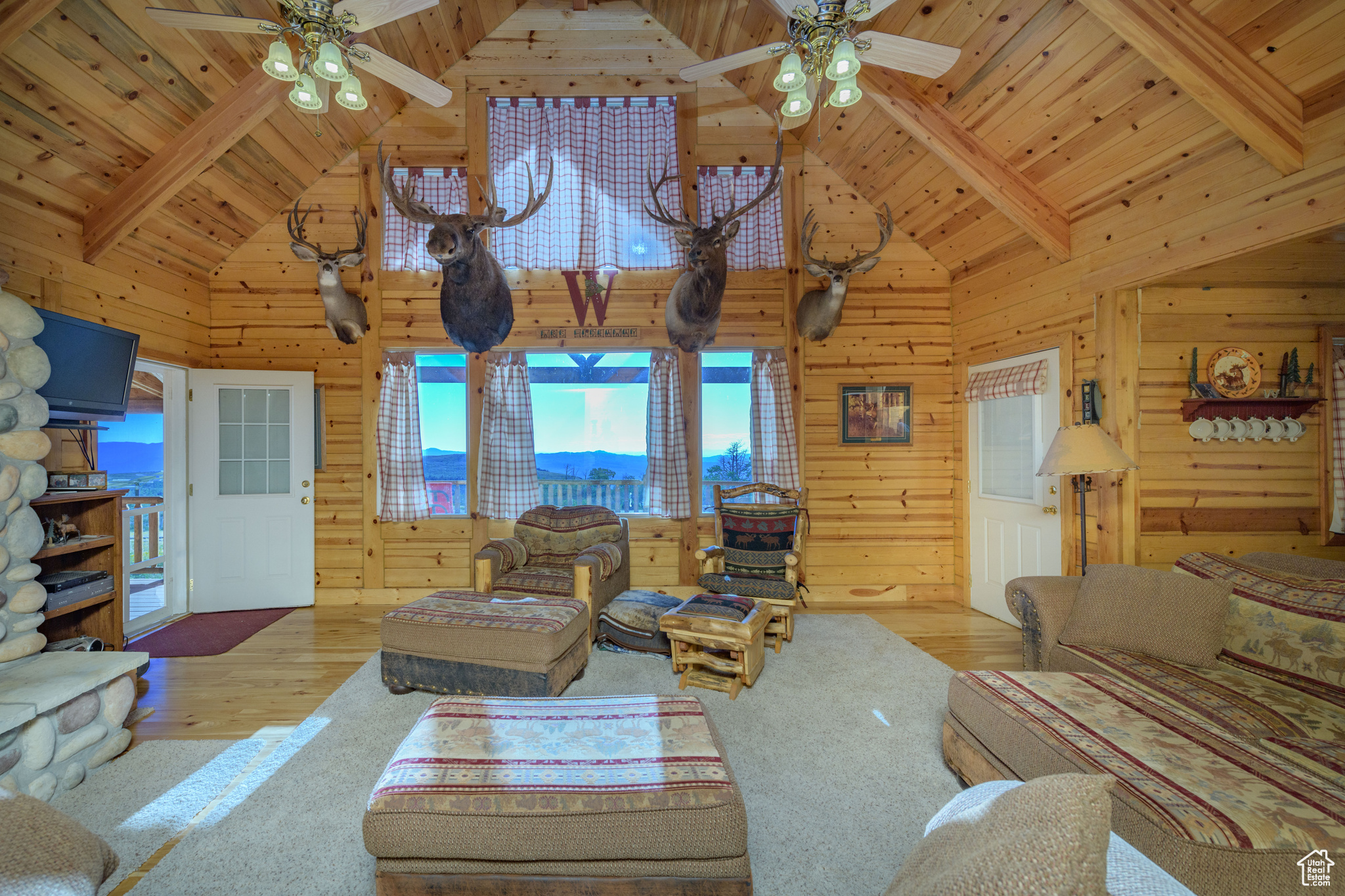 Living room featuring beamed ceiling and wooden ceiling